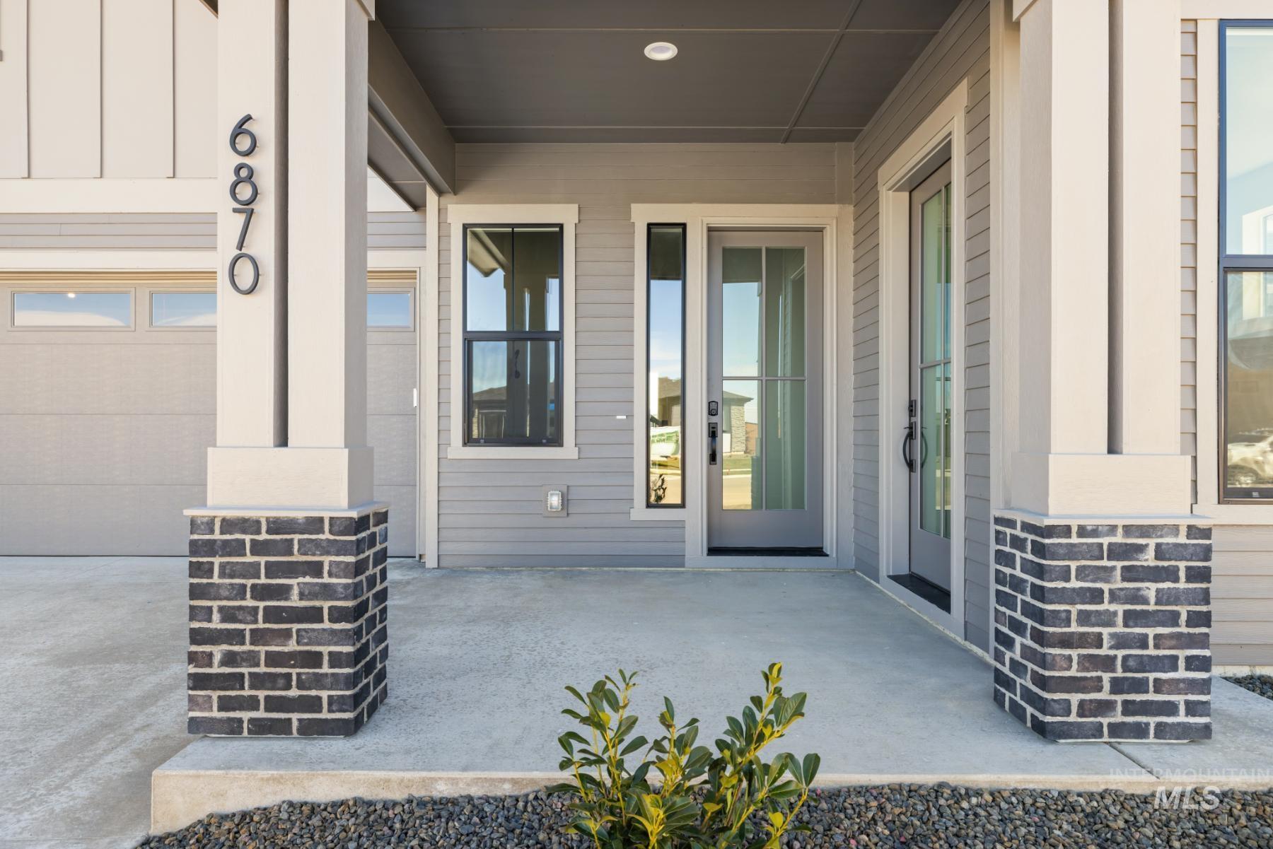Property entrance with a patio area