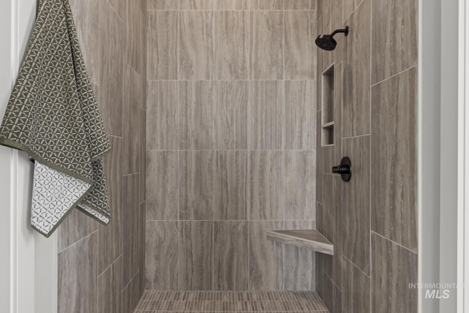 Bathroom featuring tiled shower
