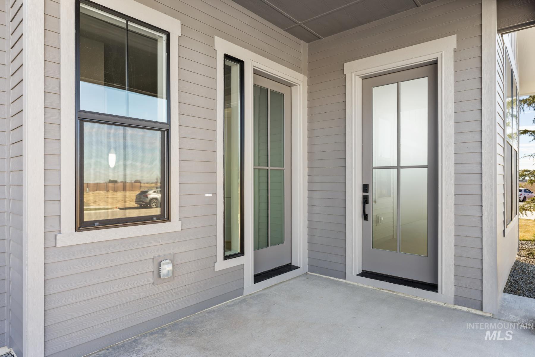 Property entrance featuring a patio area