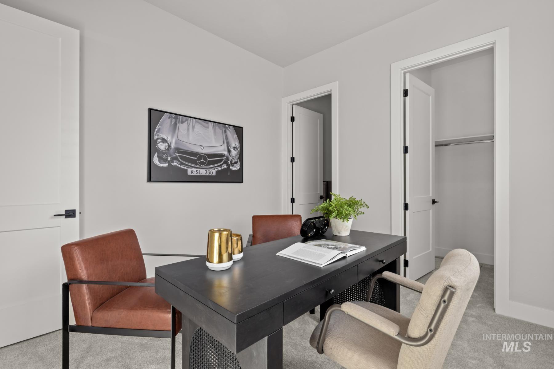 Office space featuring light carpet and baseboards