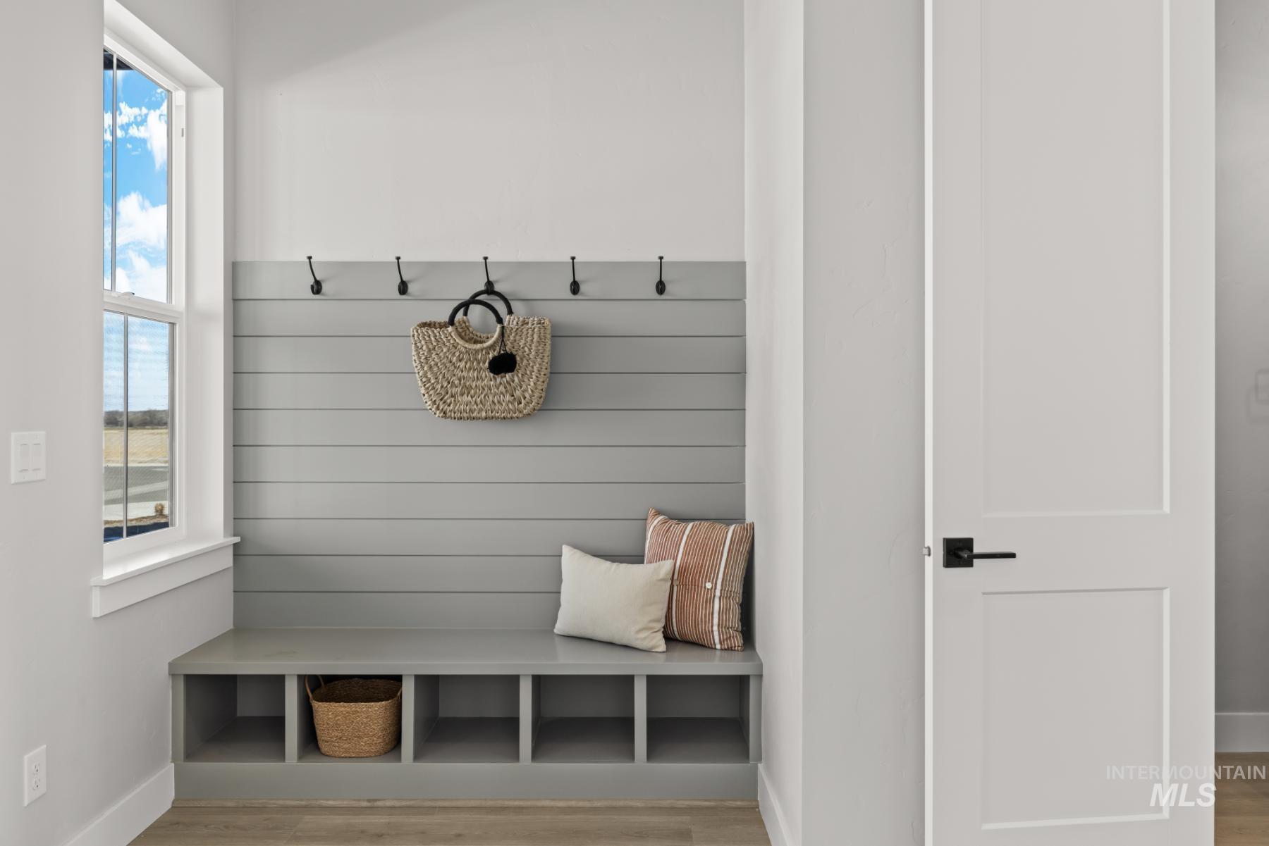 Mudroom with wood finished floors