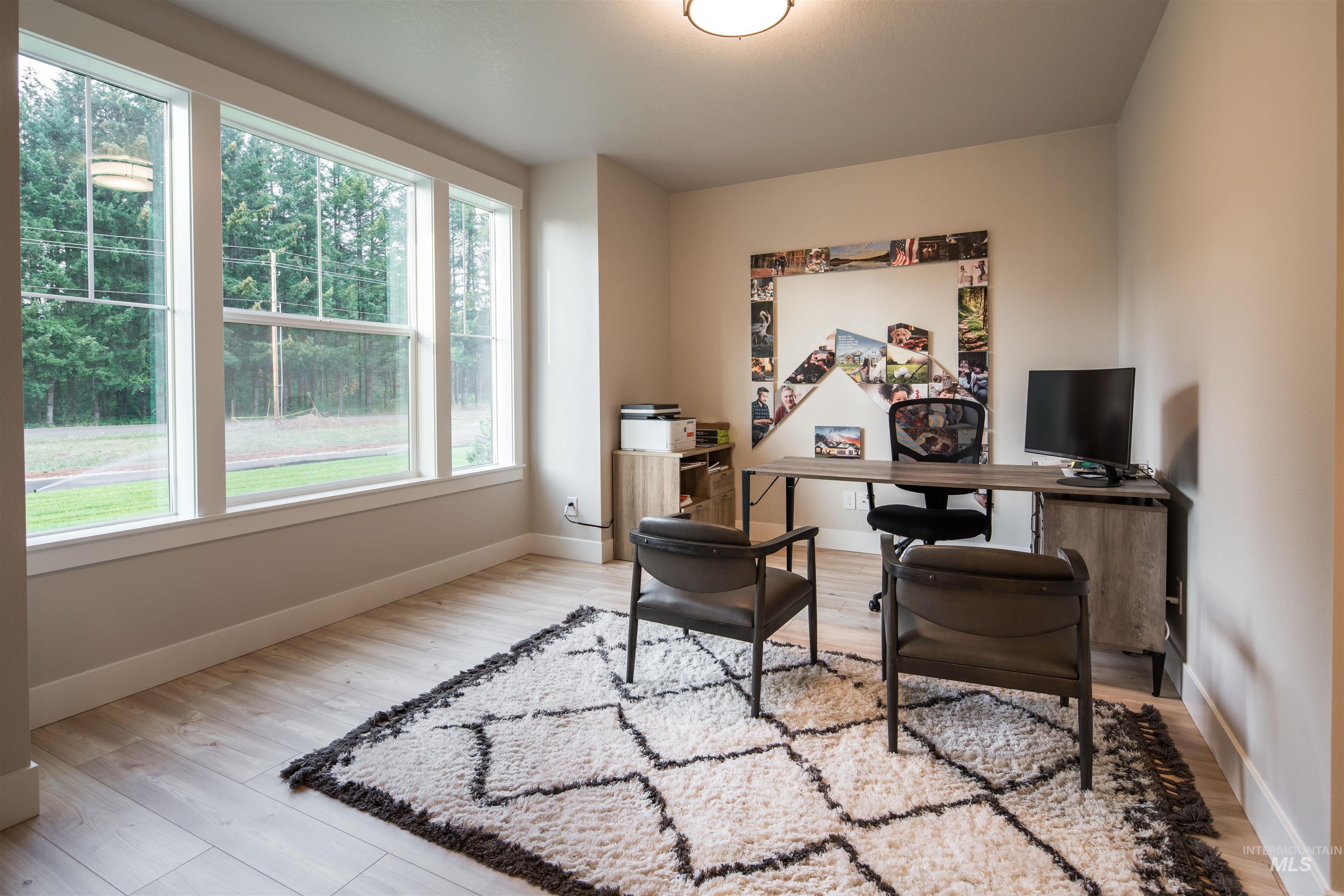 Office area featuring light wood finished floors