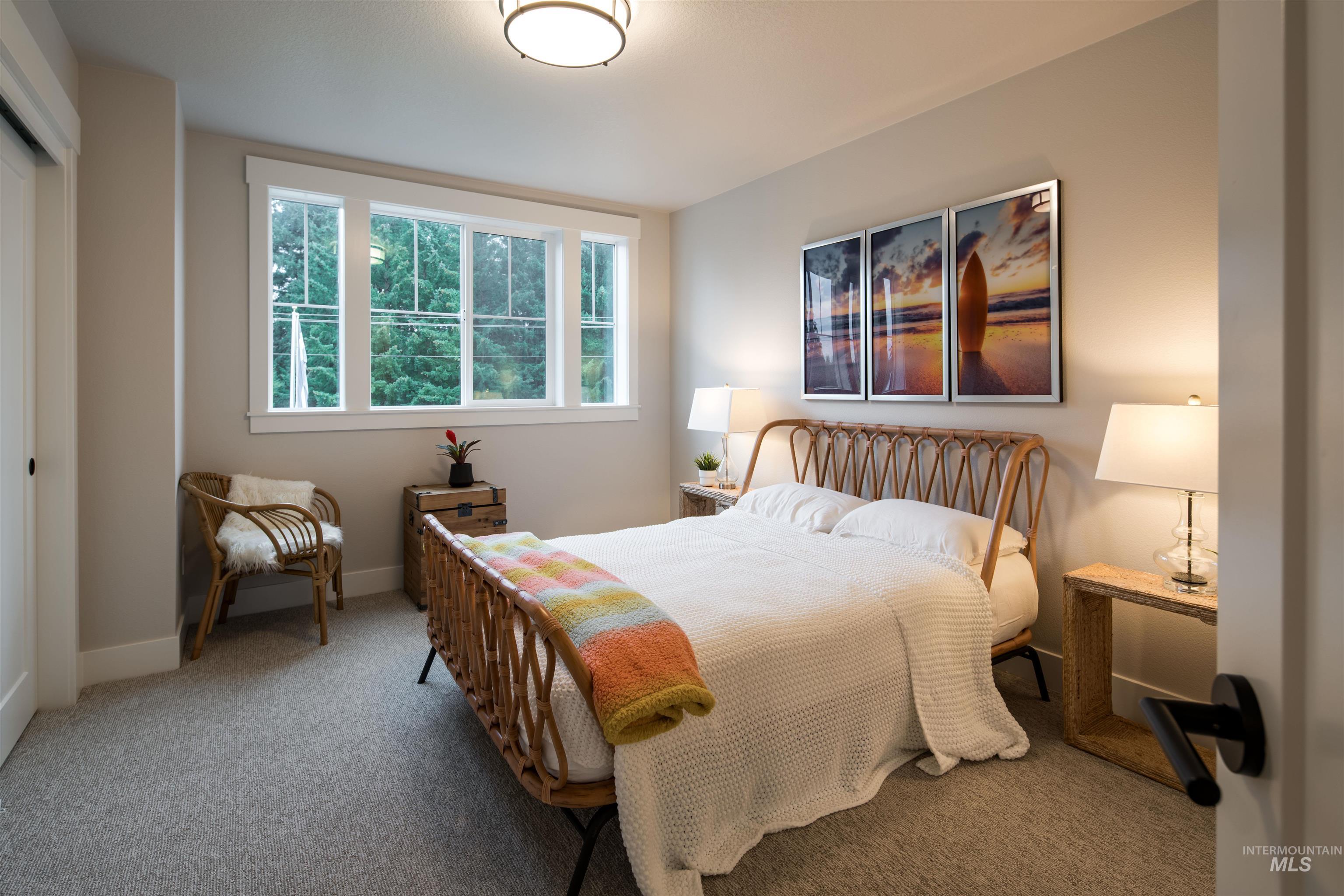 Carpeted bedroom with baseboards