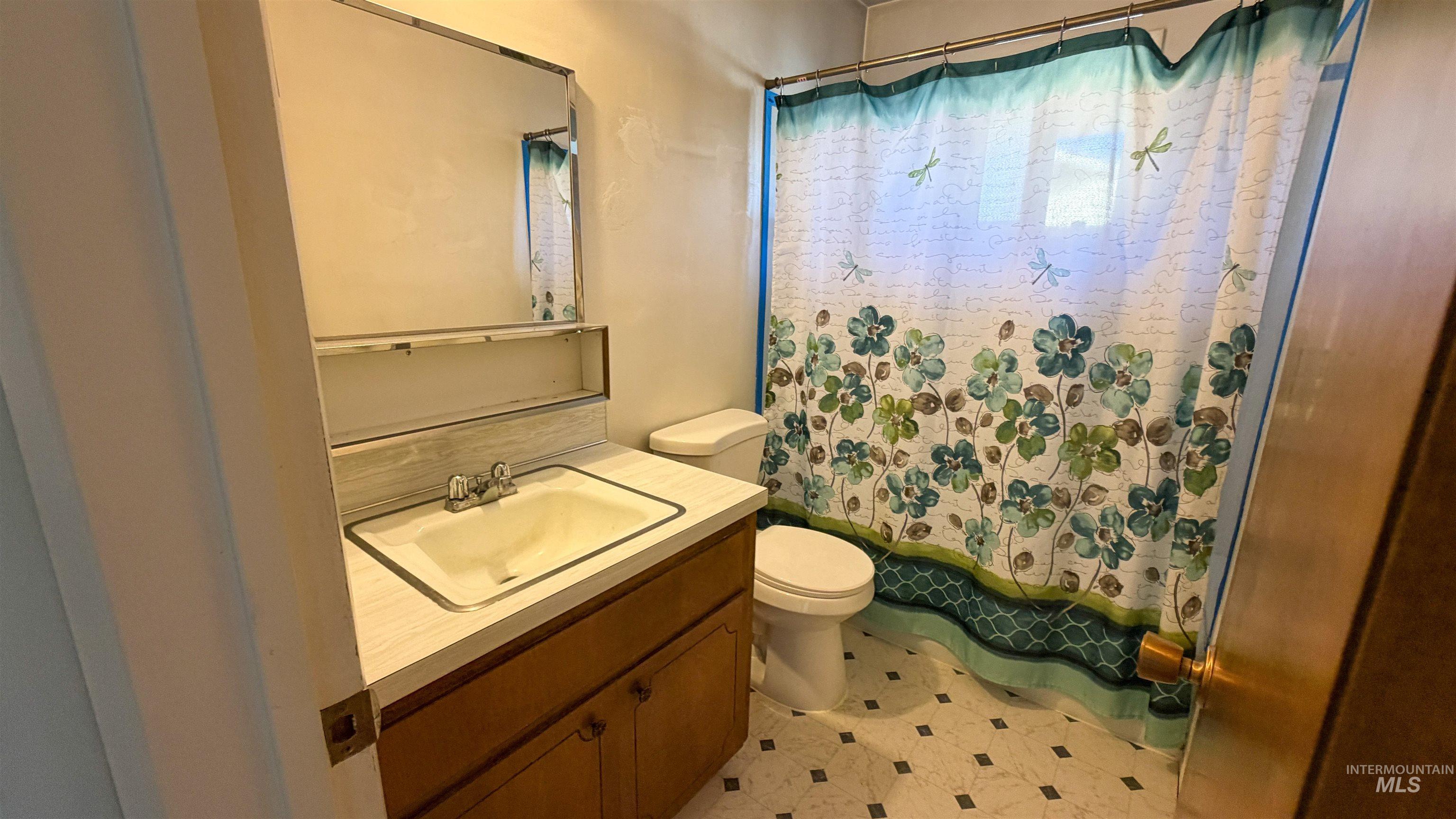 Full bath with vanity and toilet