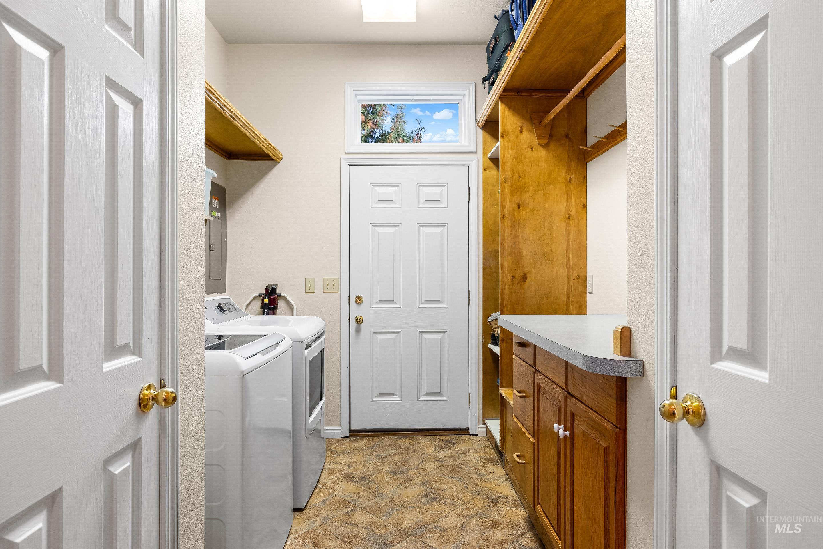 Washroom with washing machine and dryer