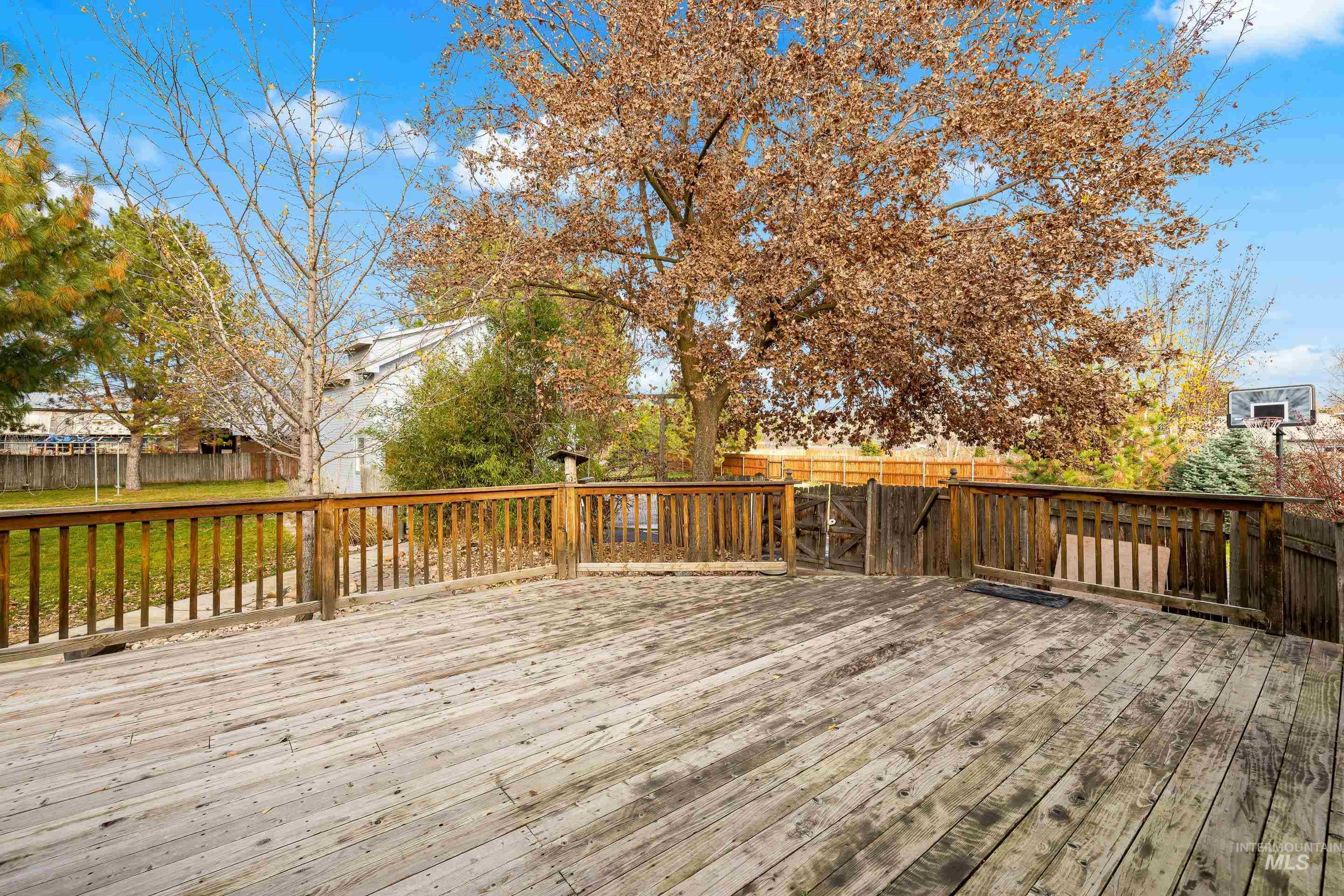 Deck with a fenced backyard