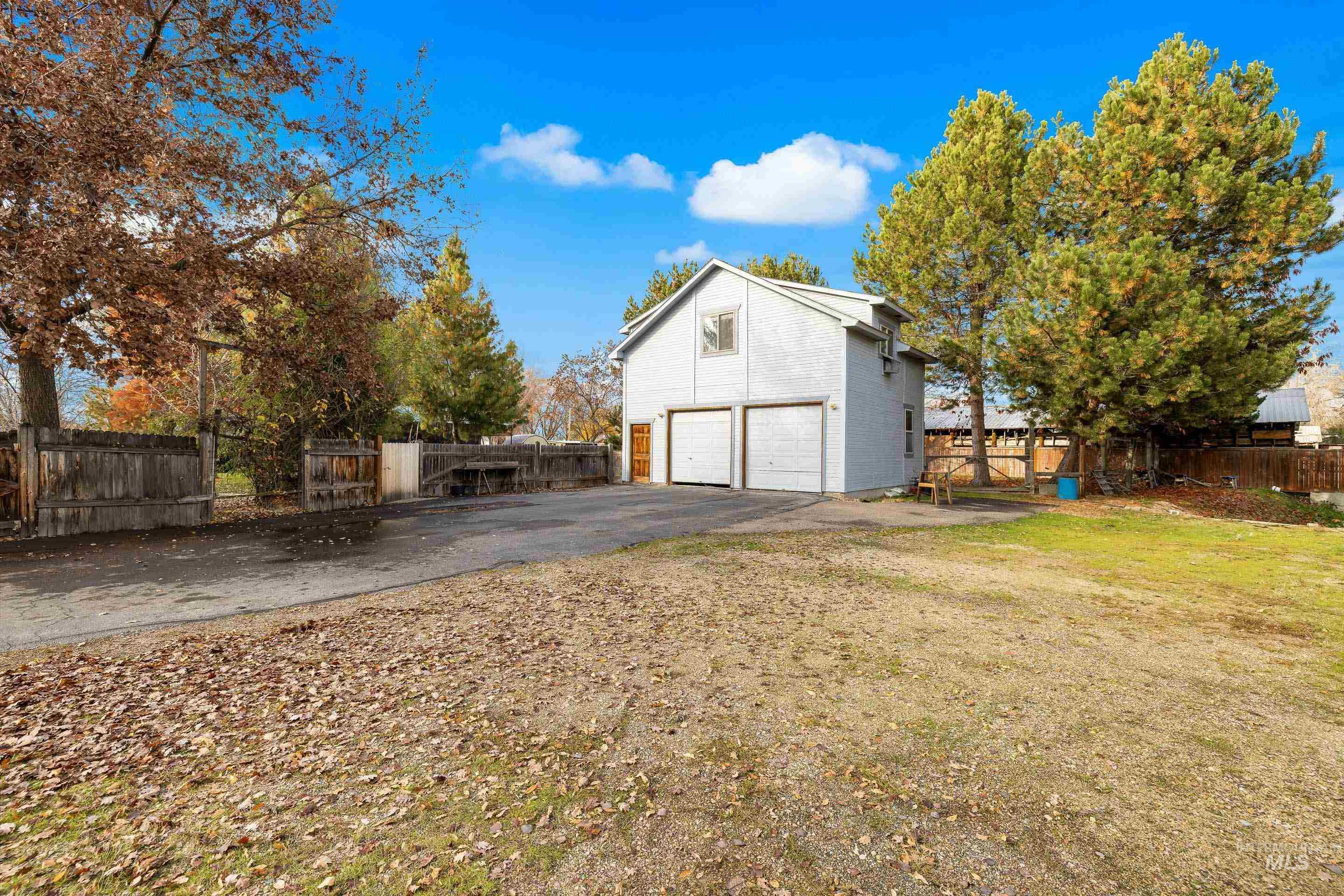 Garage featuring driveway