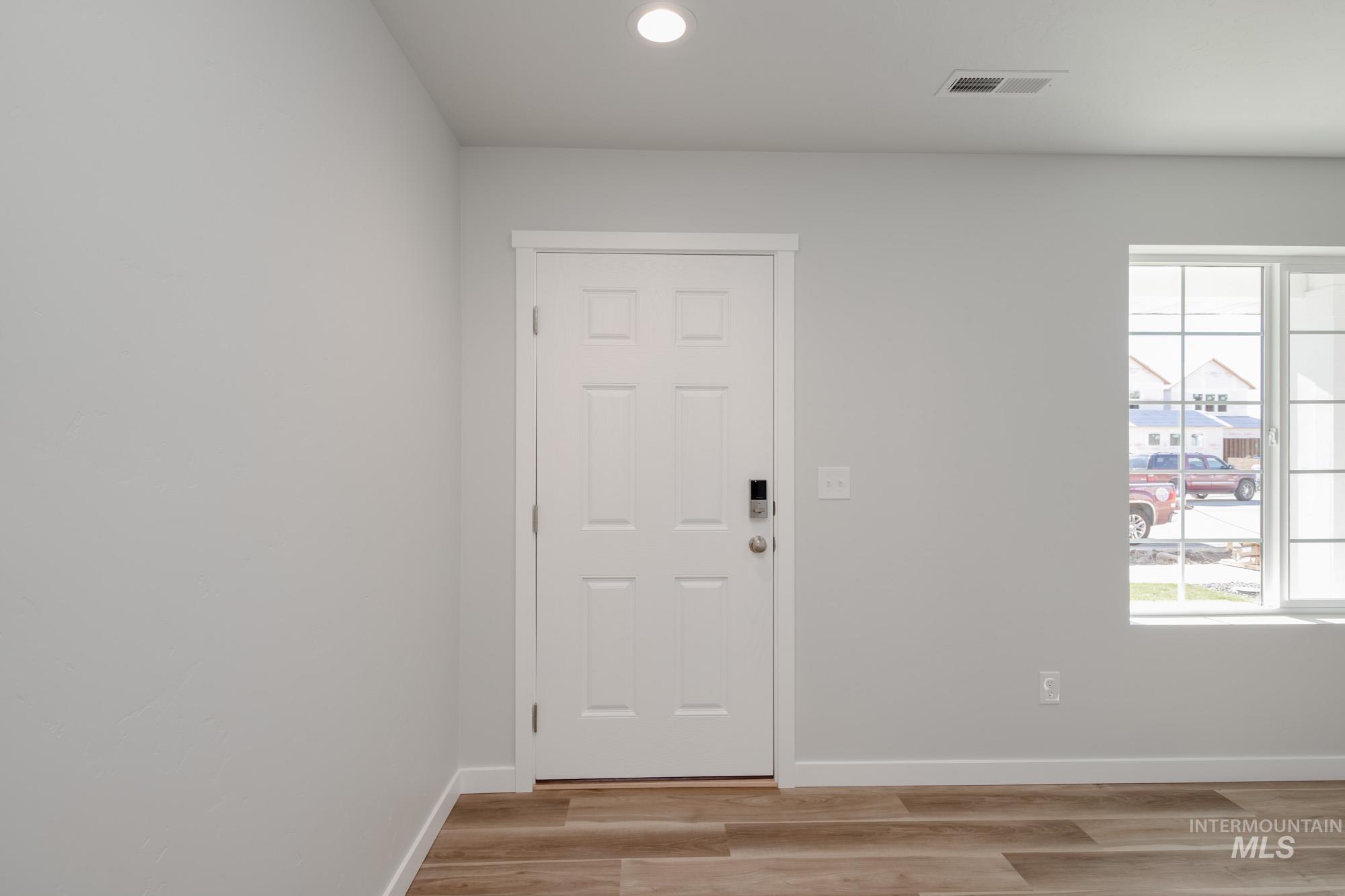 Foyer featuring recessed lighting and light wood-style flooring