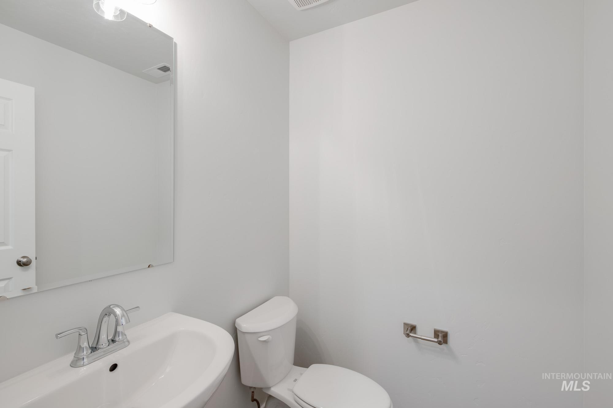 Bathroom featuring a sink and toilet