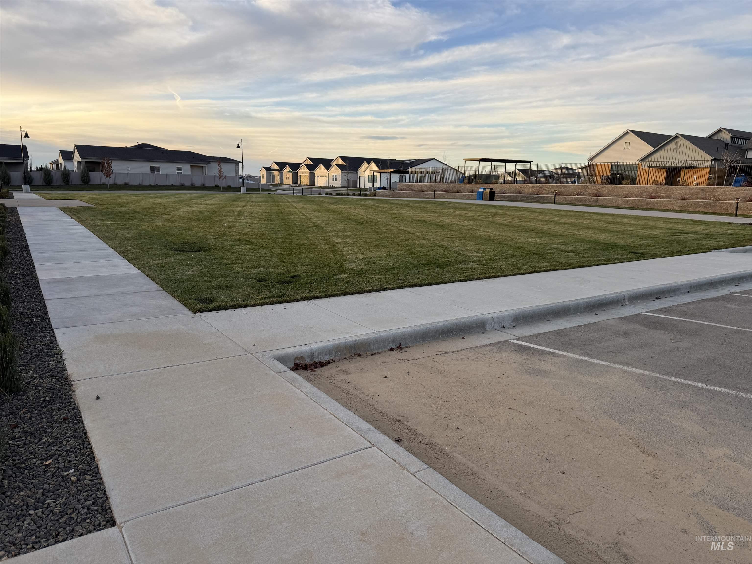 View of green lawn featuring a residential view