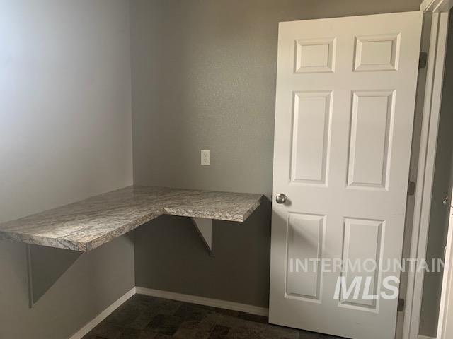 Unfurnished office with baseboards