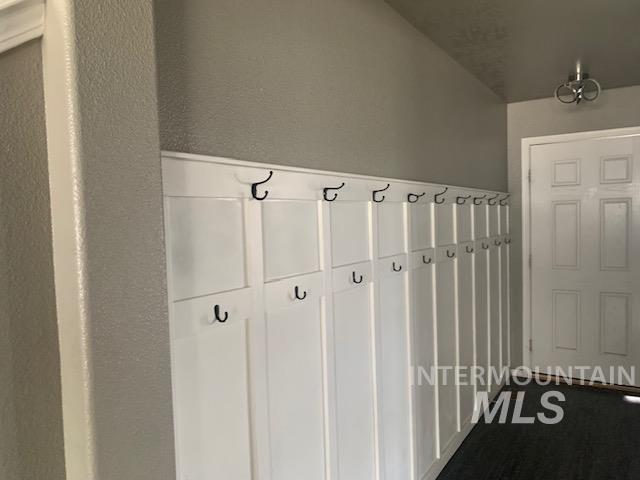 Mudroom with a textured wall