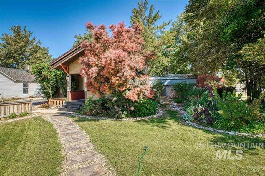 View of front of property with a front lawn