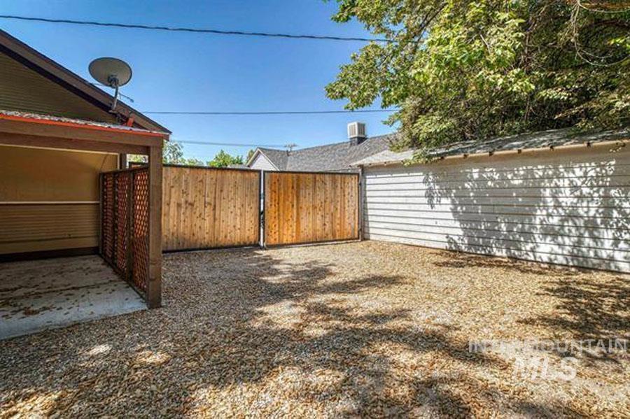 View of yard with a gate and a patio area