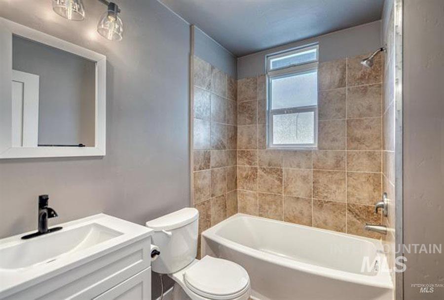 Full bath with shower / bath combination and vanity