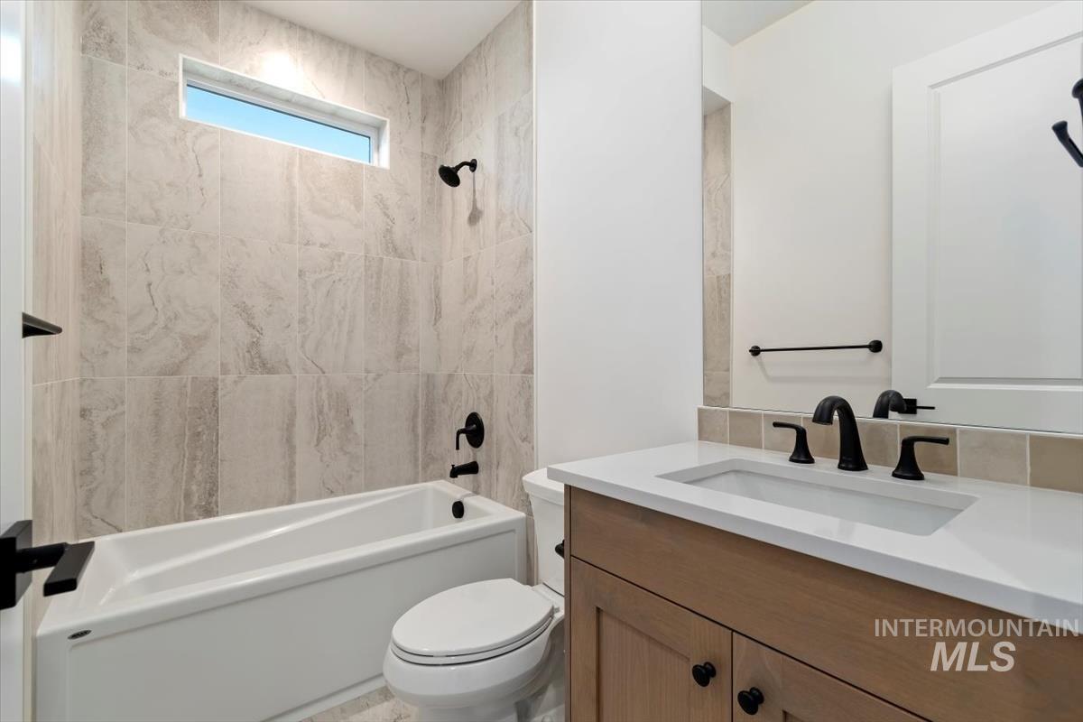 Full bathroom with vanity and tub / shower combination
