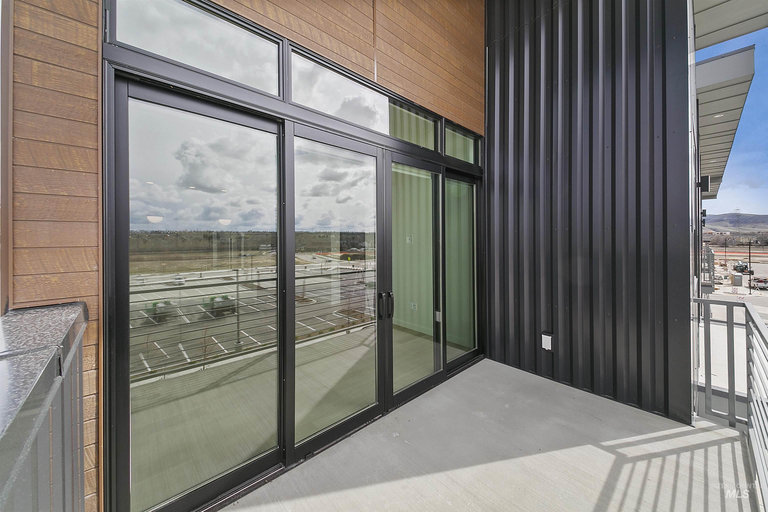 Exterior space featuring expansive windows