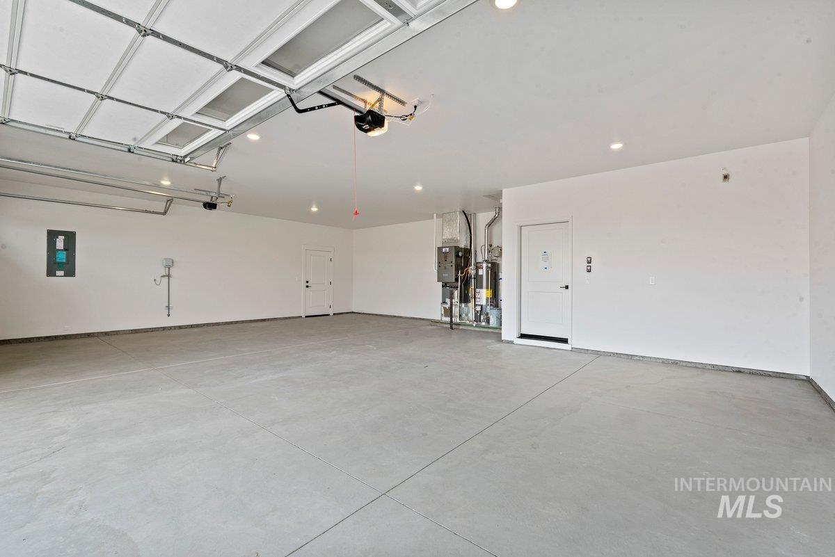 Garage with electric panel and water heater