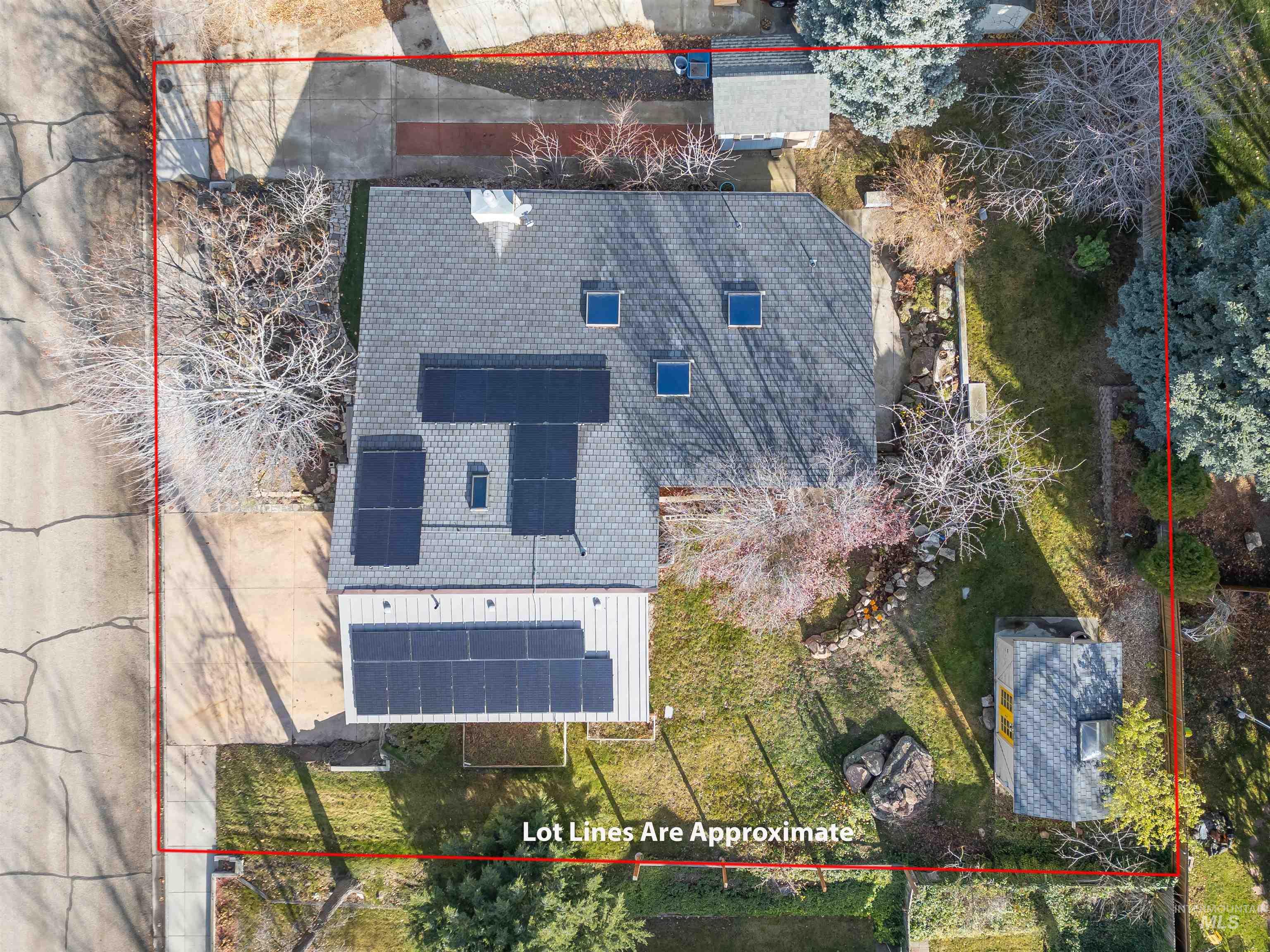 Aerial view of property and surrounding area featuring property boundaries highlighted