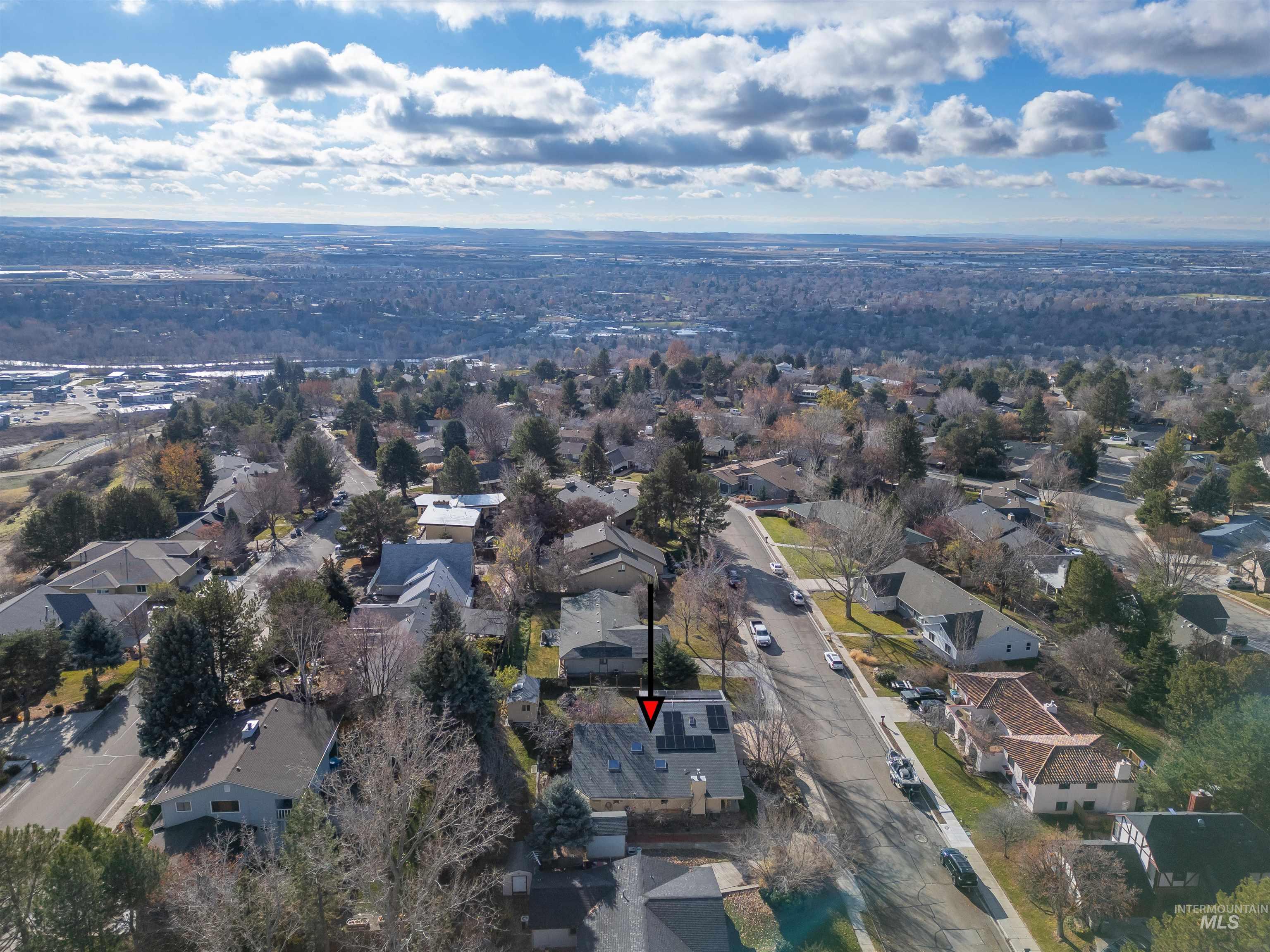 Aerial overview of property's location with nearby suburban area