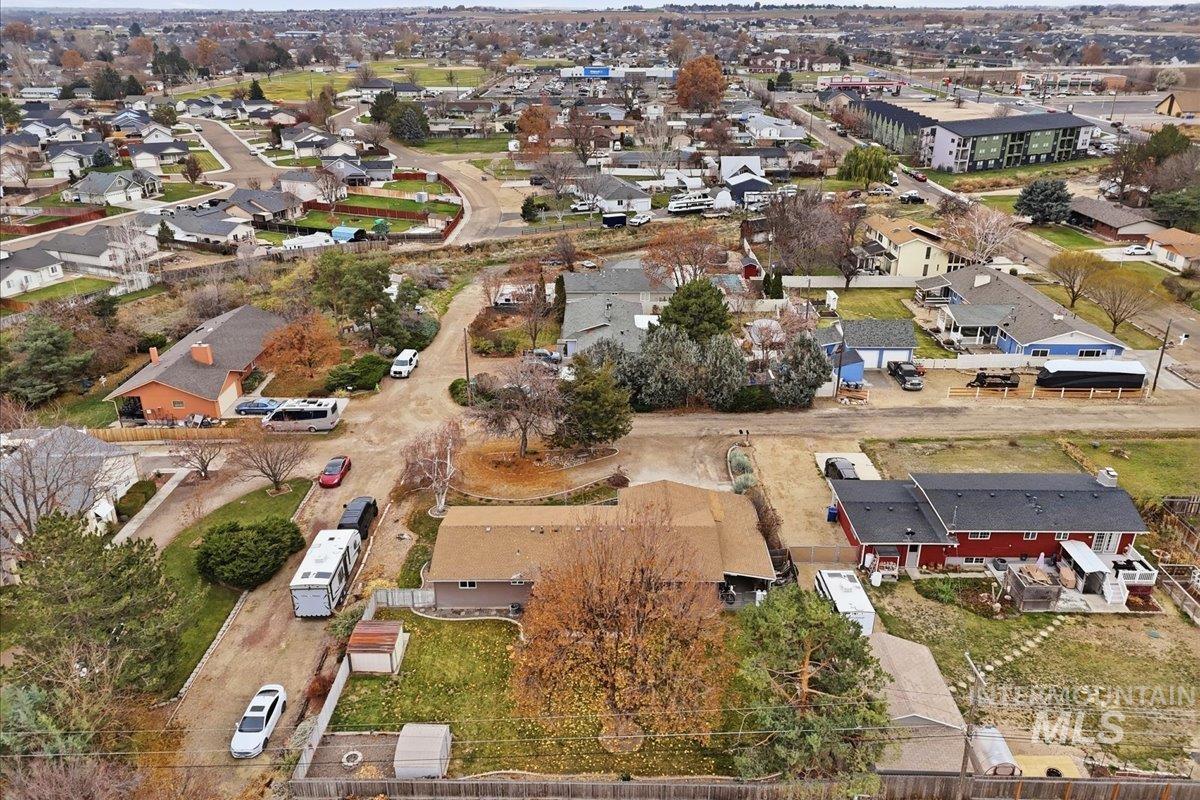 Aerial overview of property's location featuring nearby suburban area
