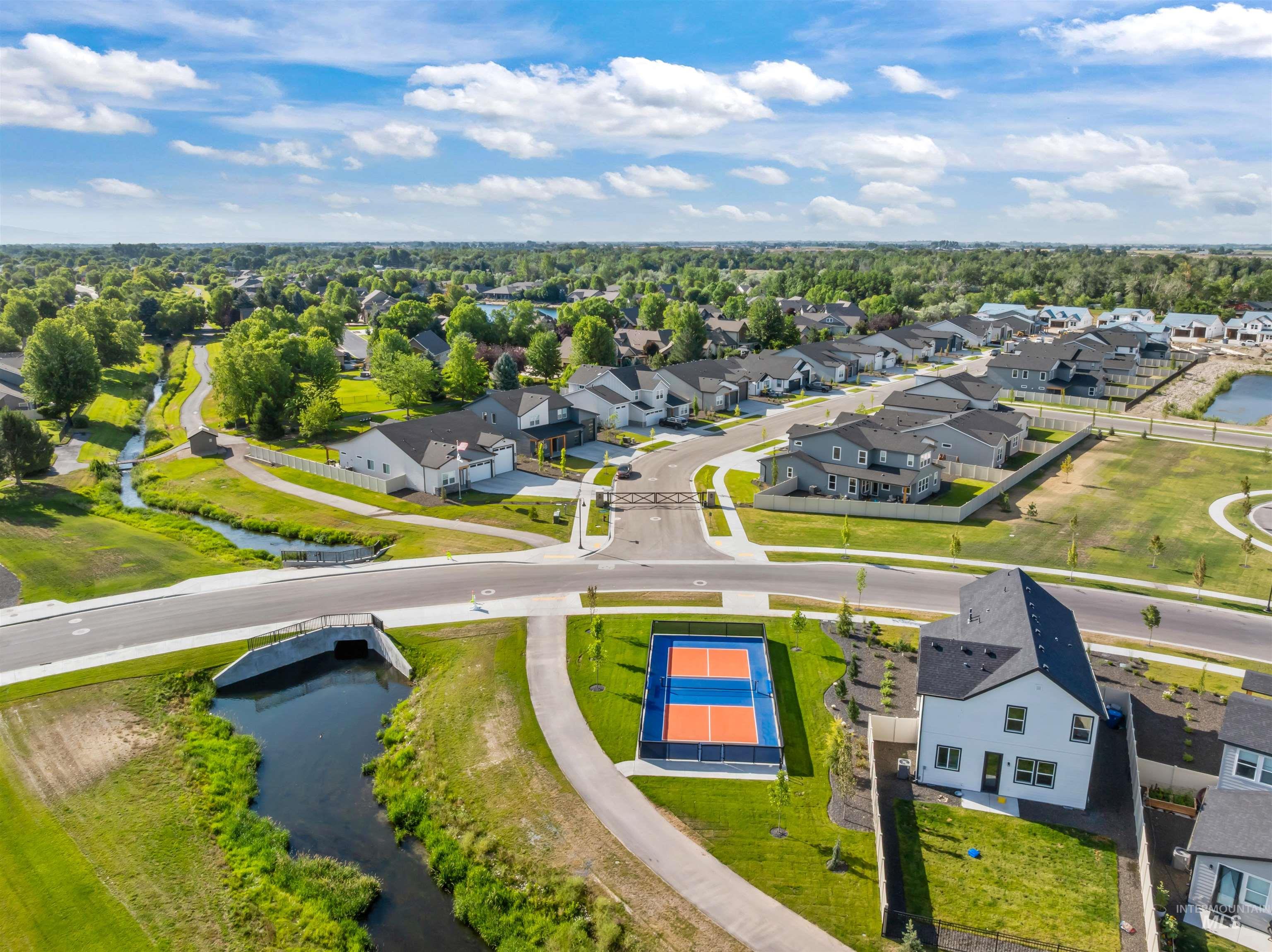 Aerial perspective of suburban area with a large body of water