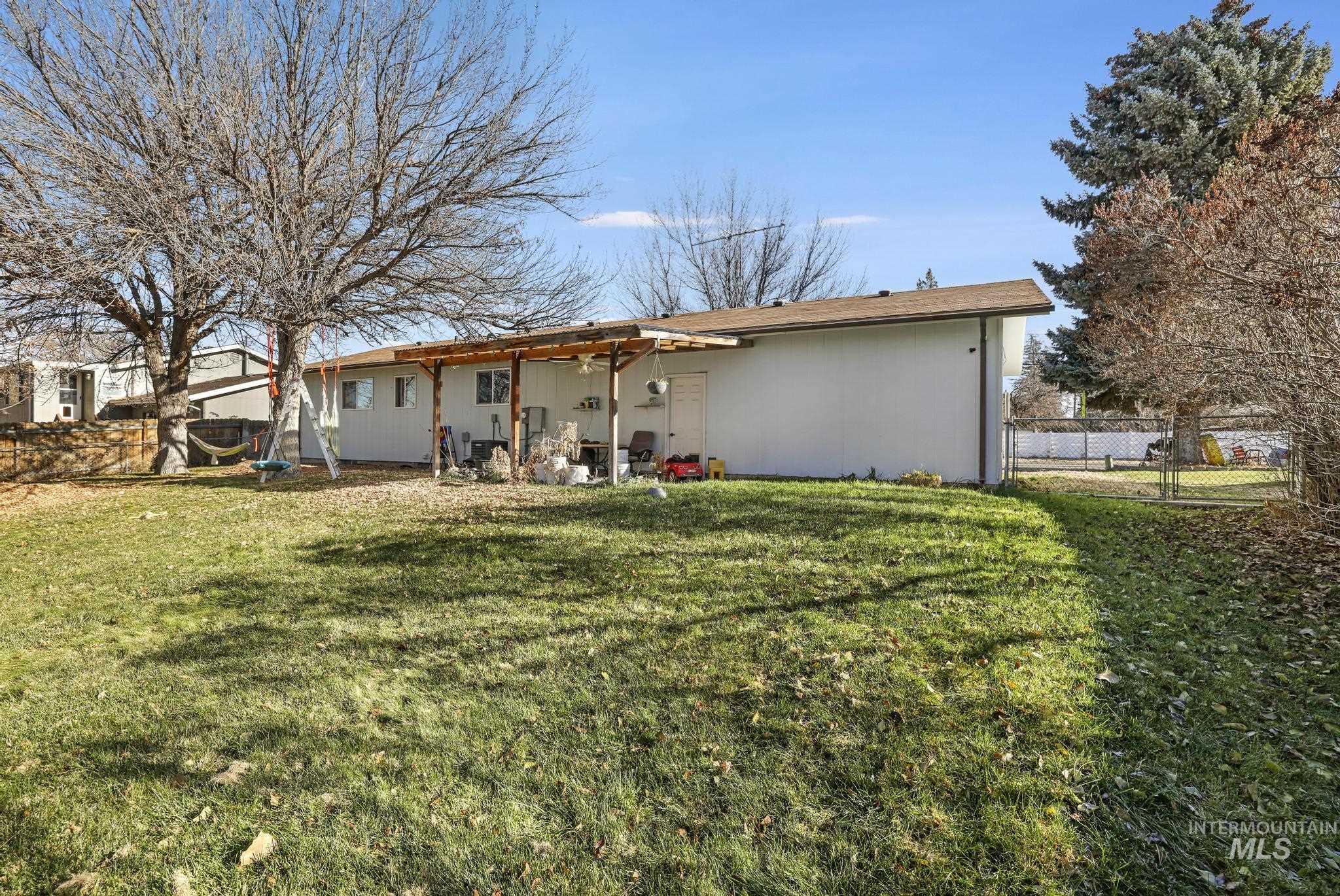 Rear view of house with a patio and ceiling fan