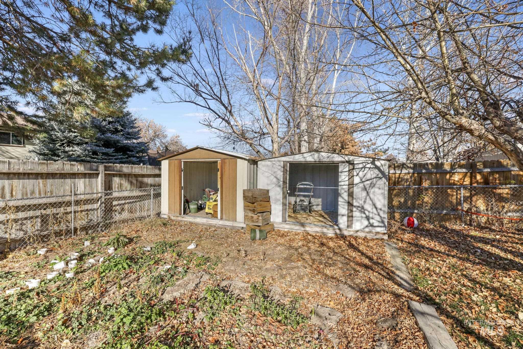View of shed with a fenced backyard