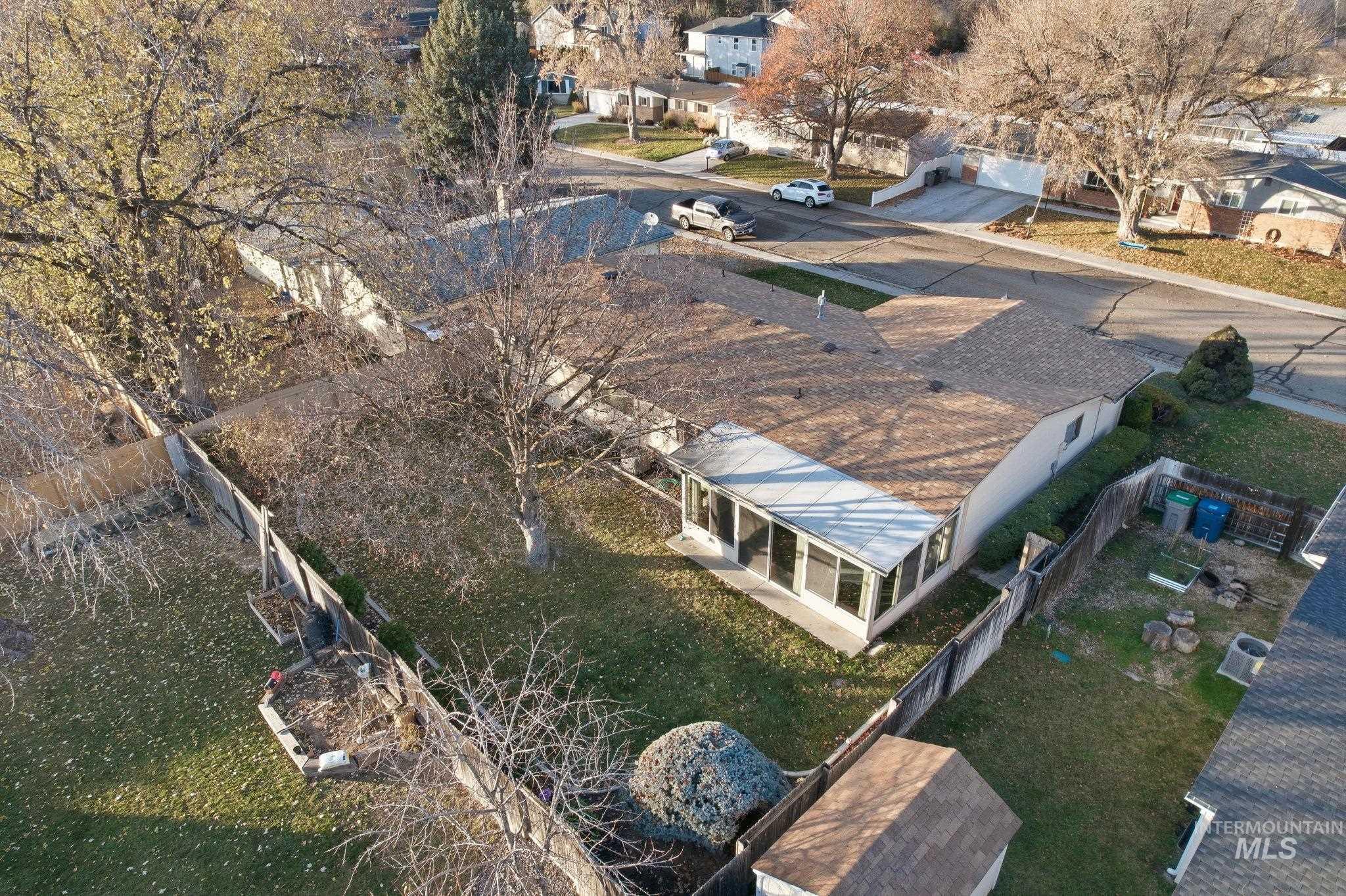 Aerial overview of property's location featuring nearby suburban area