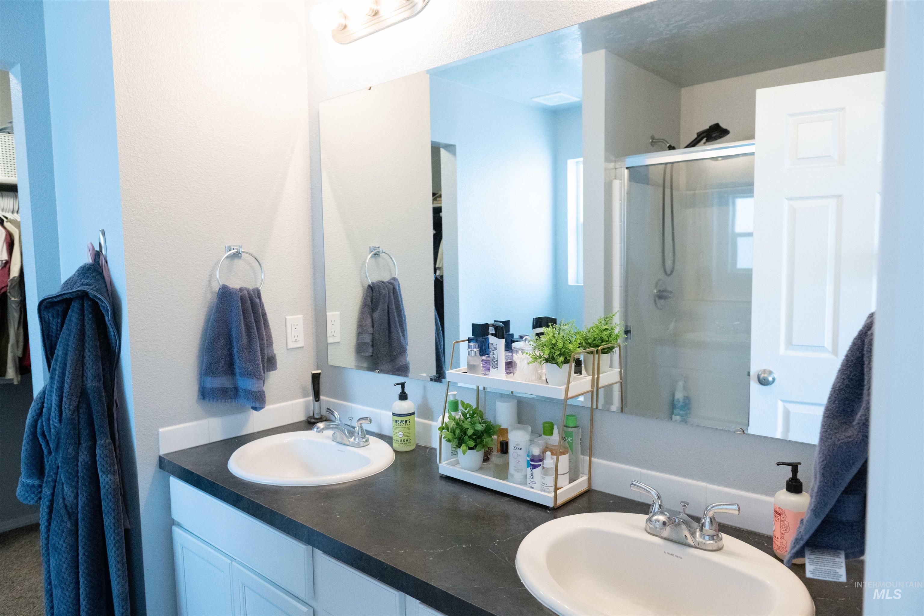 Bathroom with an enclosed shower and double vanity