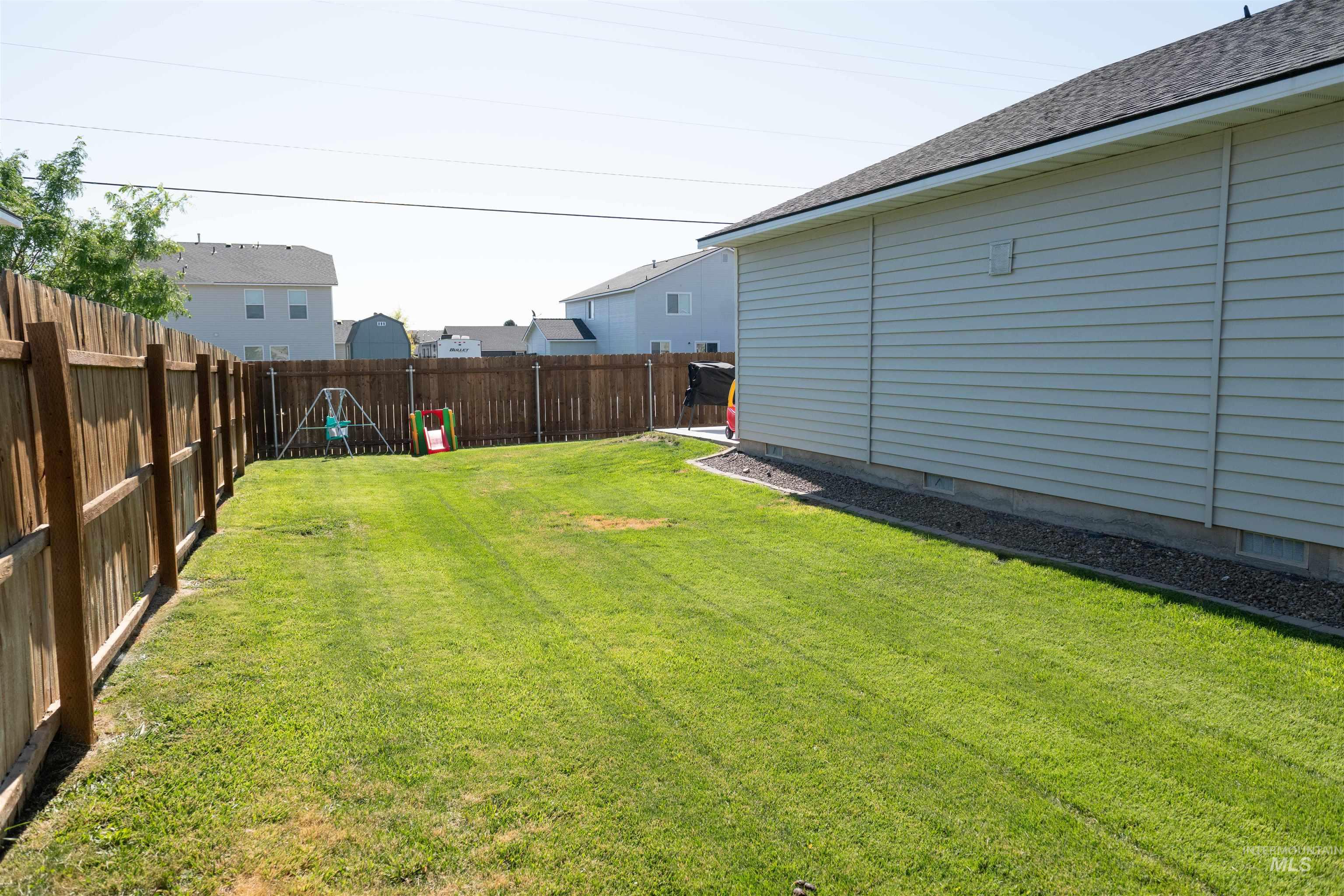 View of fenced backyard