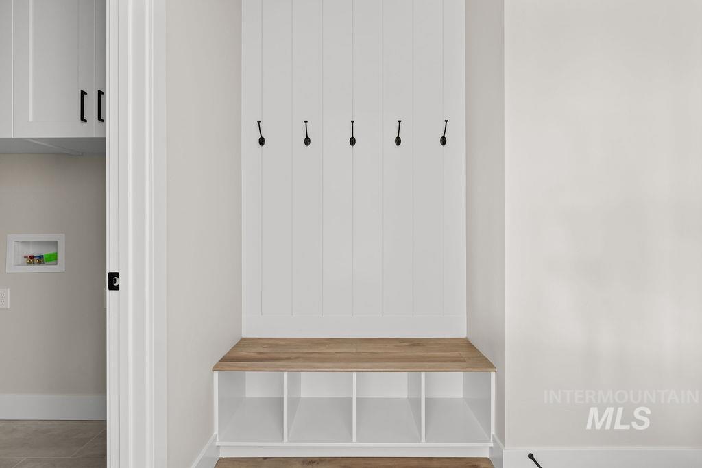 Mudroom featuring baseboards