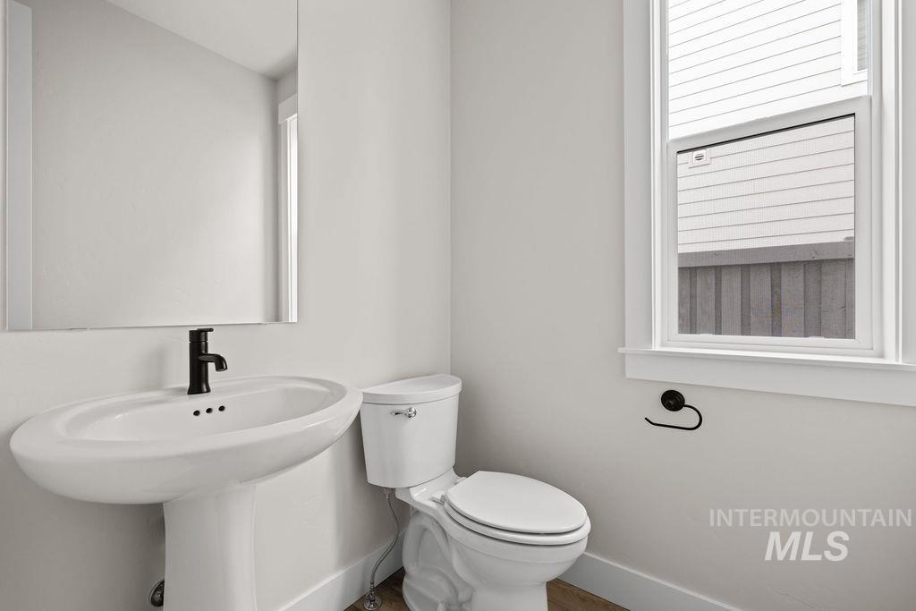 Bathroom with baseboards and toilet