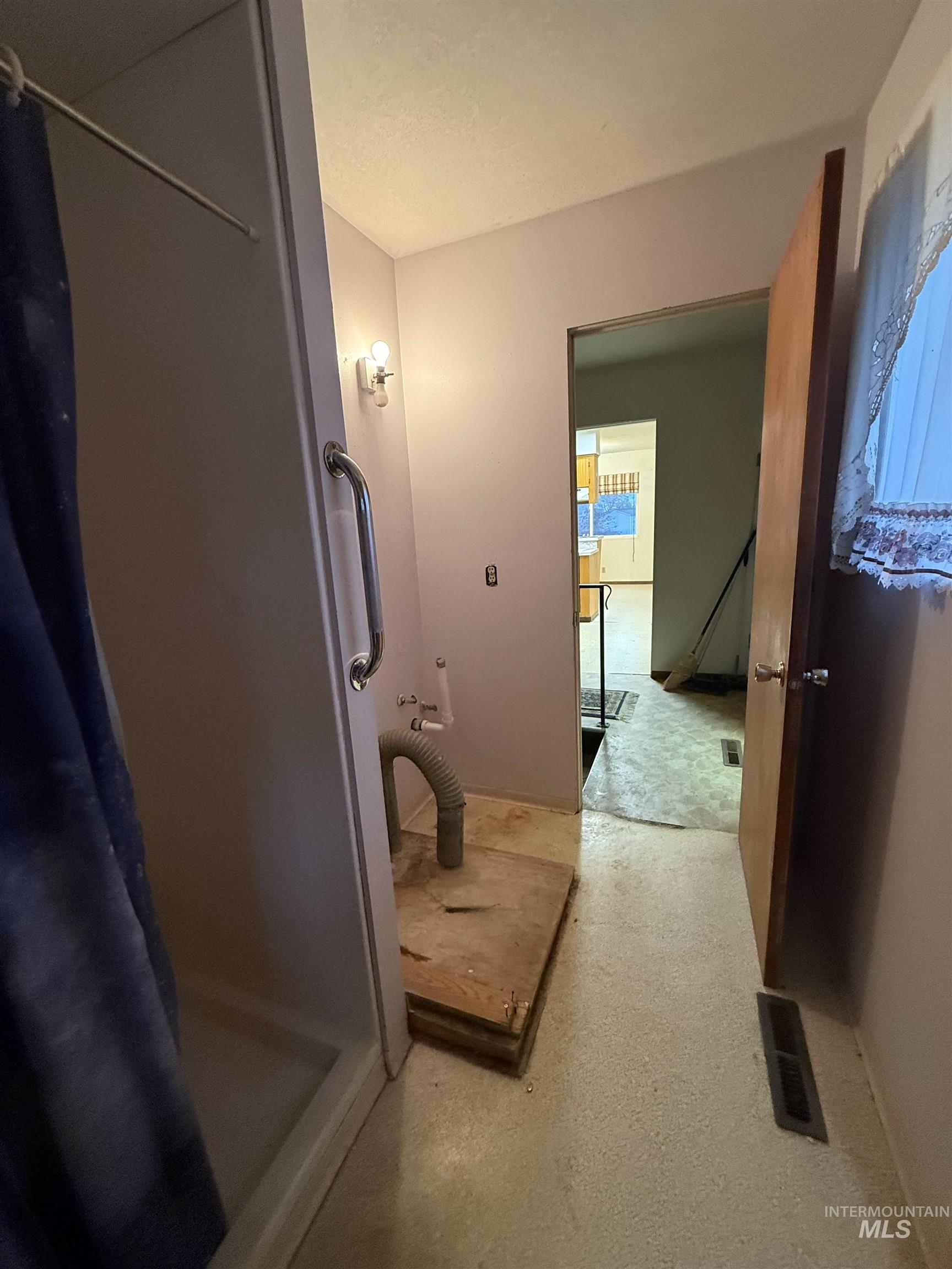 Full bathroom featuring a stall shower