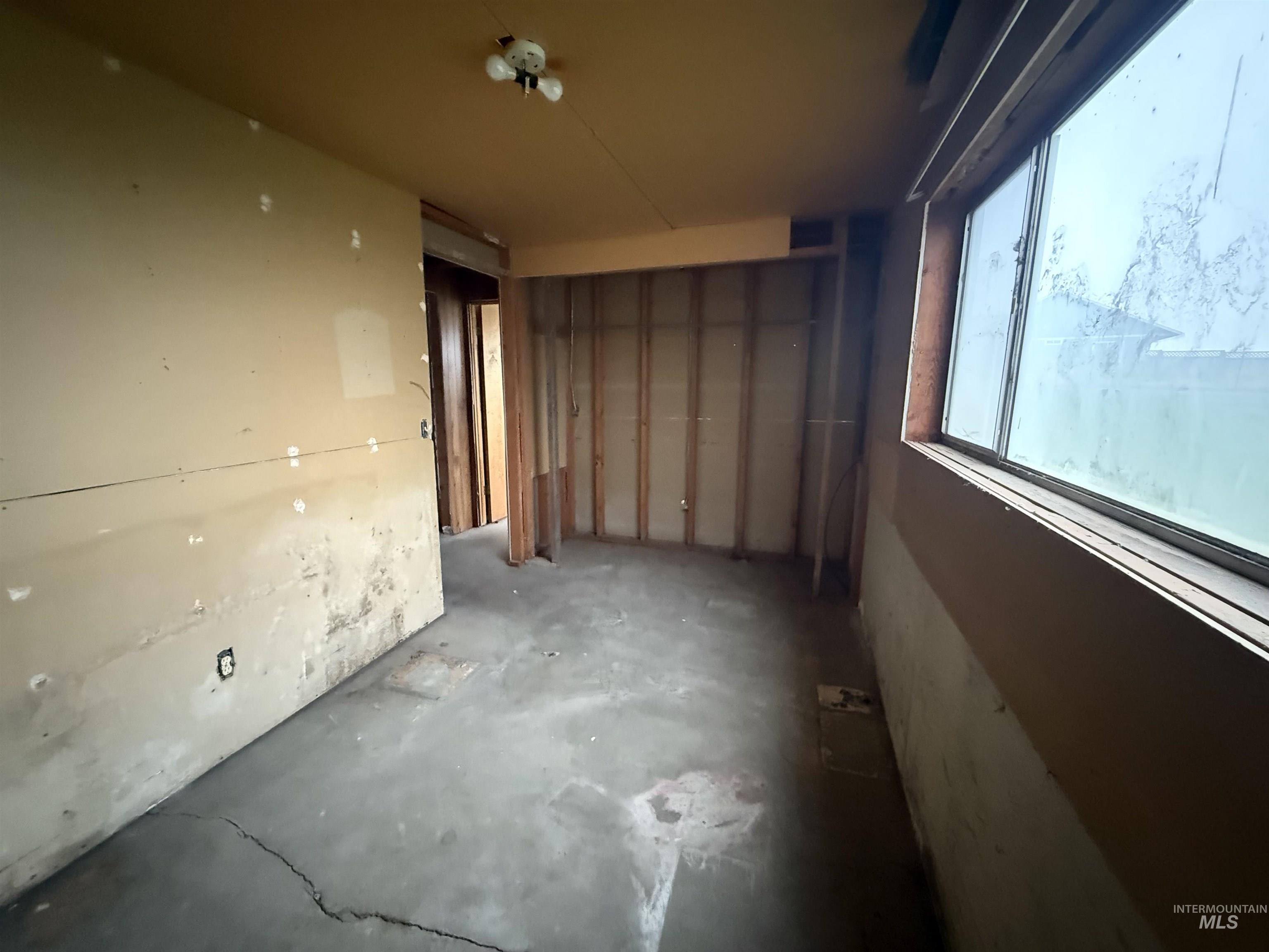 Spare room featuring concrete floors
