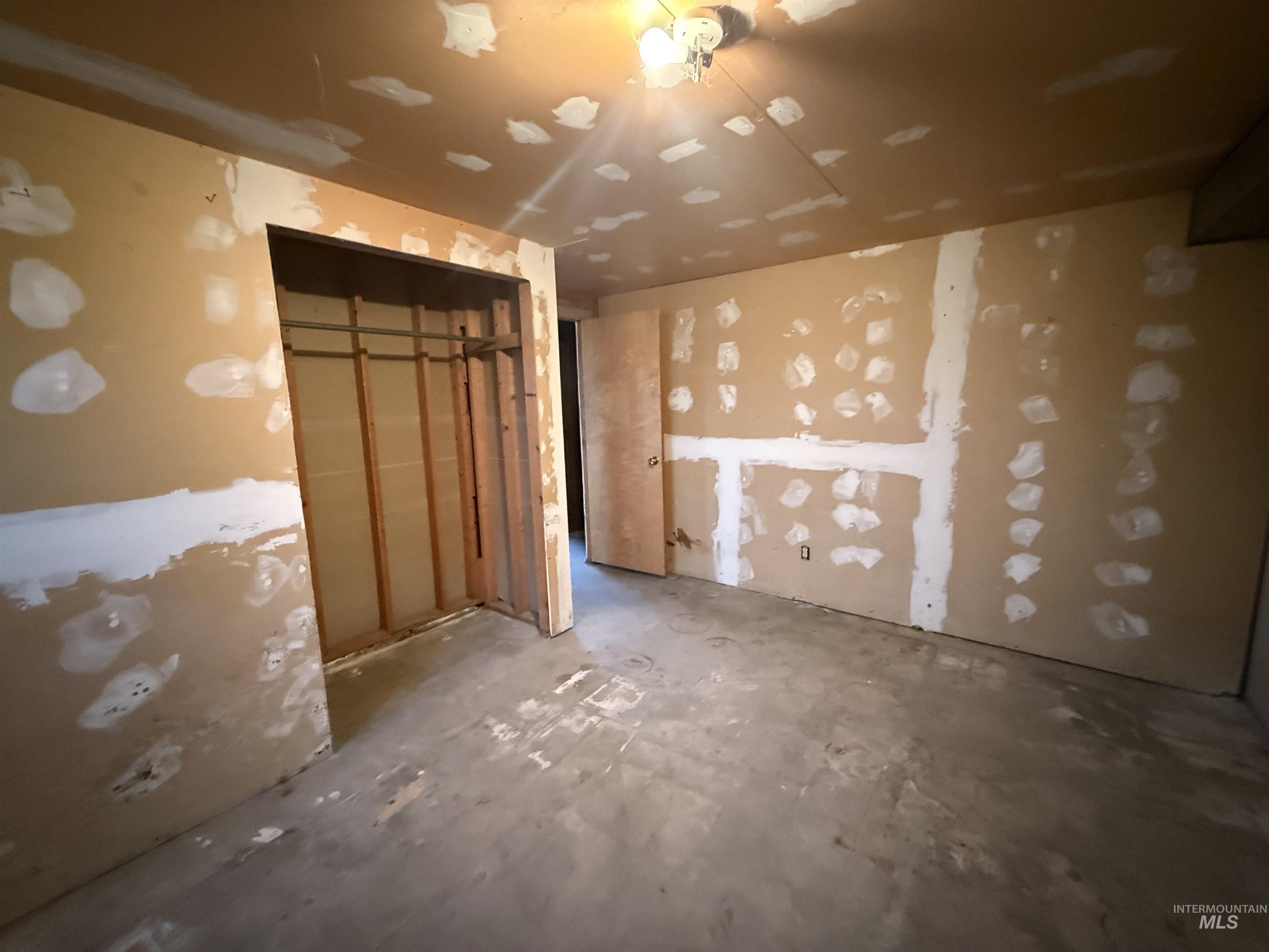 Miscellaneous room featuring unfinished concrete flooring