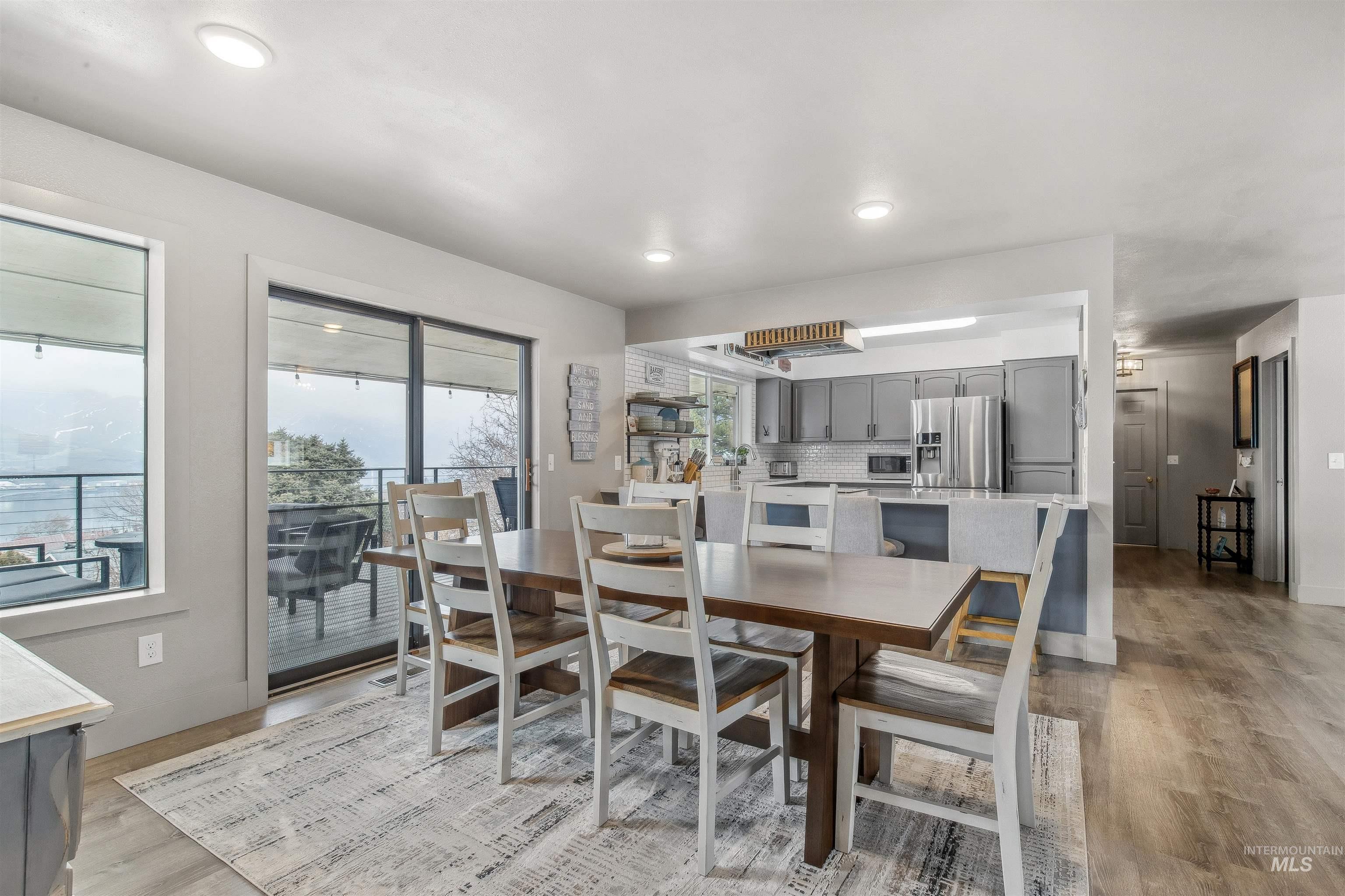 Dining area featuring light wood-style floors and recessed lighting