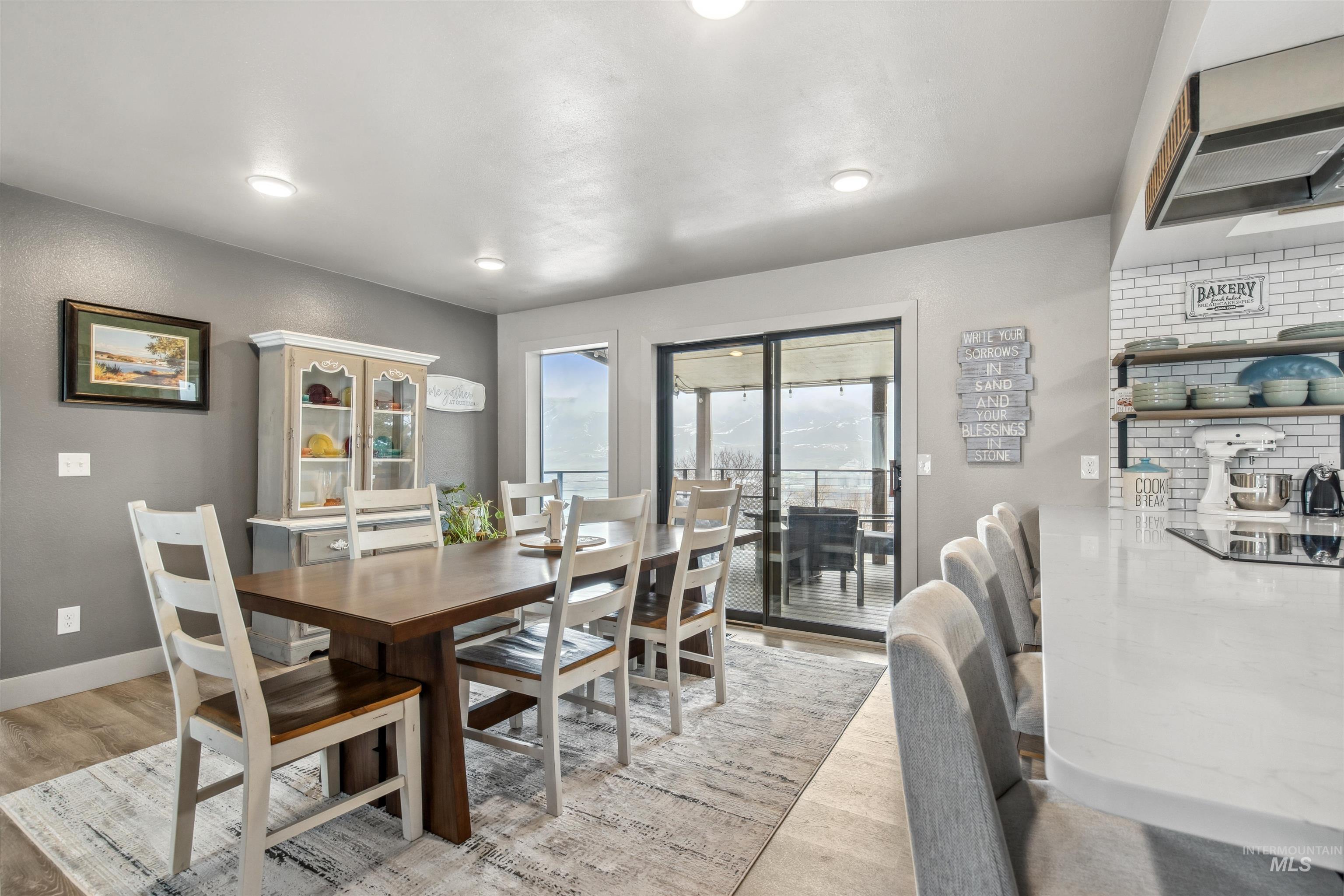 Dining area with baseboards and light wood finished floors