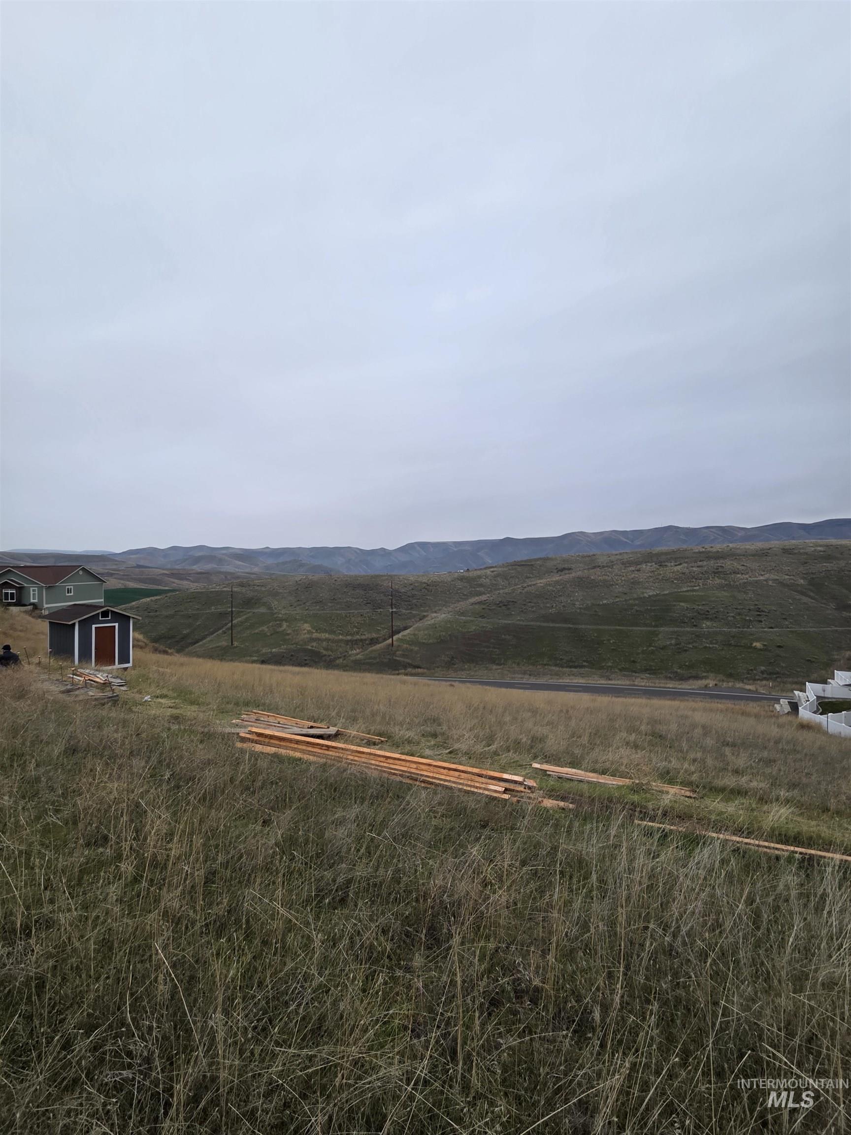 View of mountain background featuring rural landscape