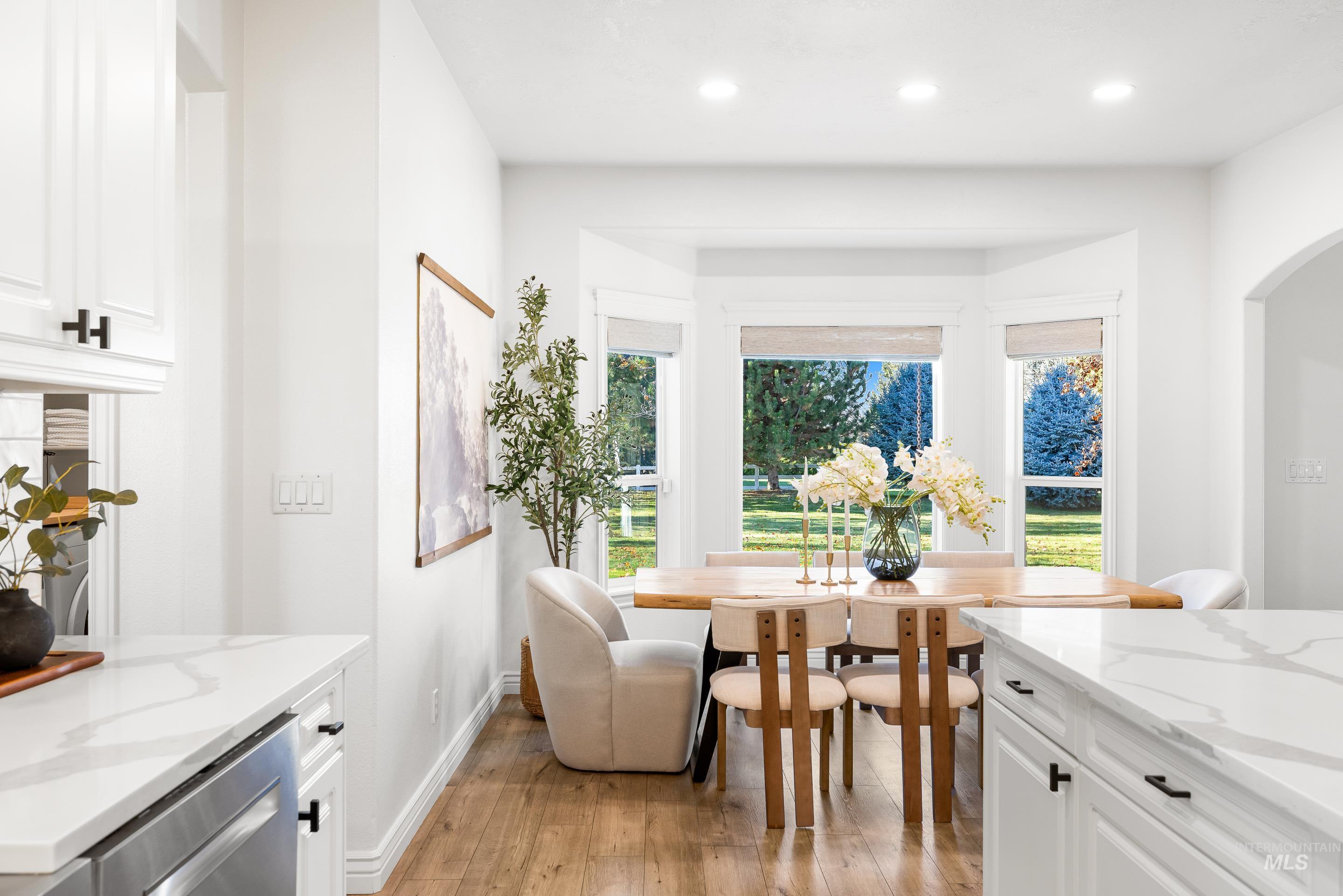 Dining room featuring light wood-style flooring and recessed lighting