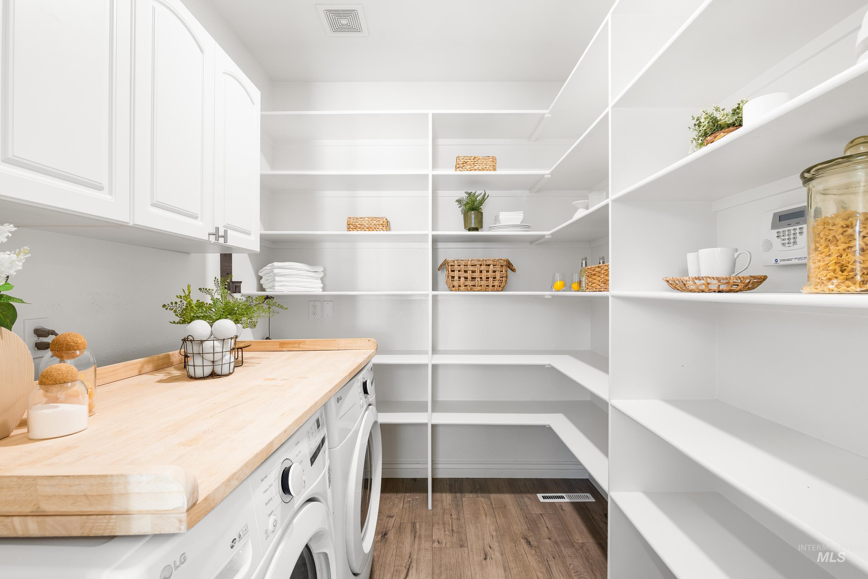 Pantry with washer and clothes dryer