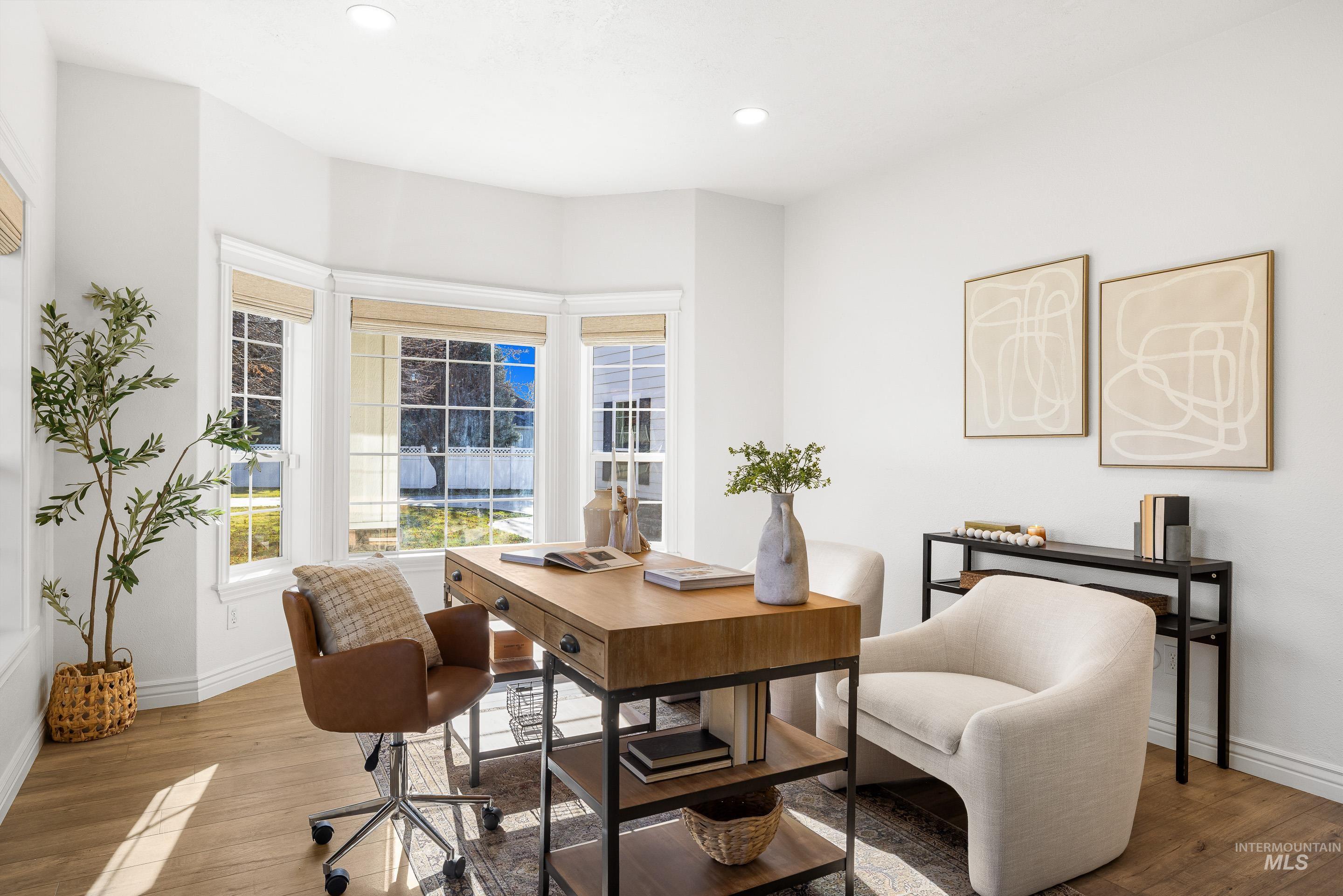 Office area featuring wood finished floors and recessed lighting