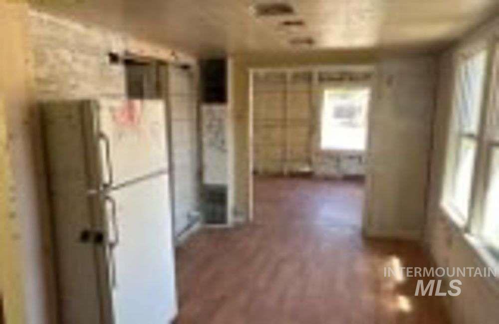 Hallway with dark wood finished floors