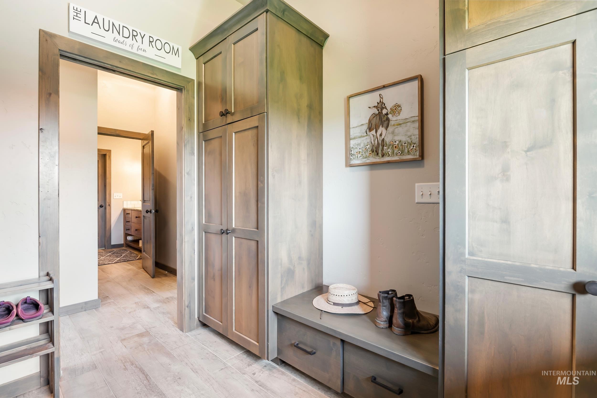 Mudroom with light wood-style flooring