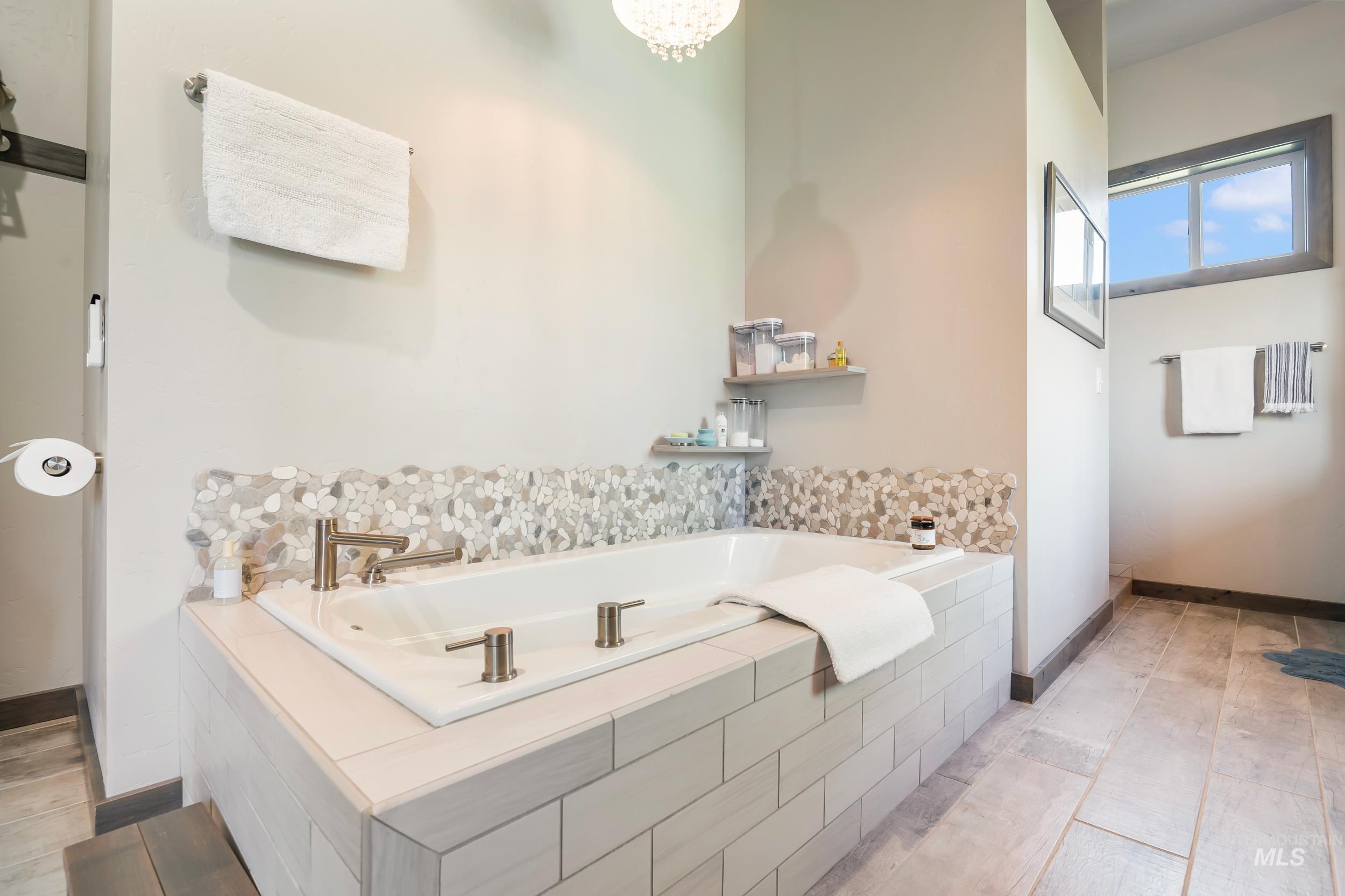 Full bathroom featuring a bath