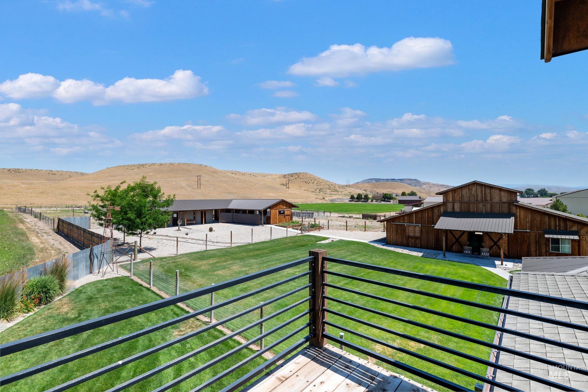 Balcony featuring a mountain view and an exterior structure
