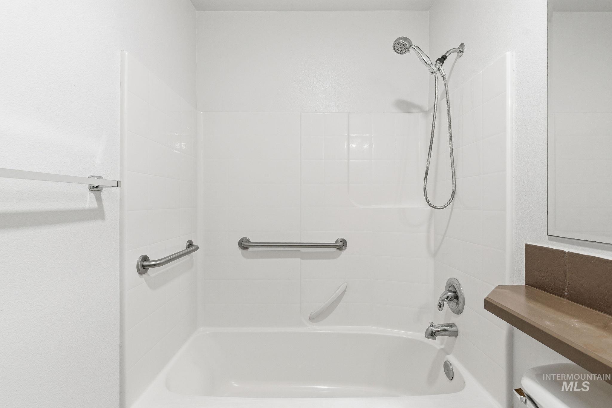 Full bathroom with shower / bathtub combination