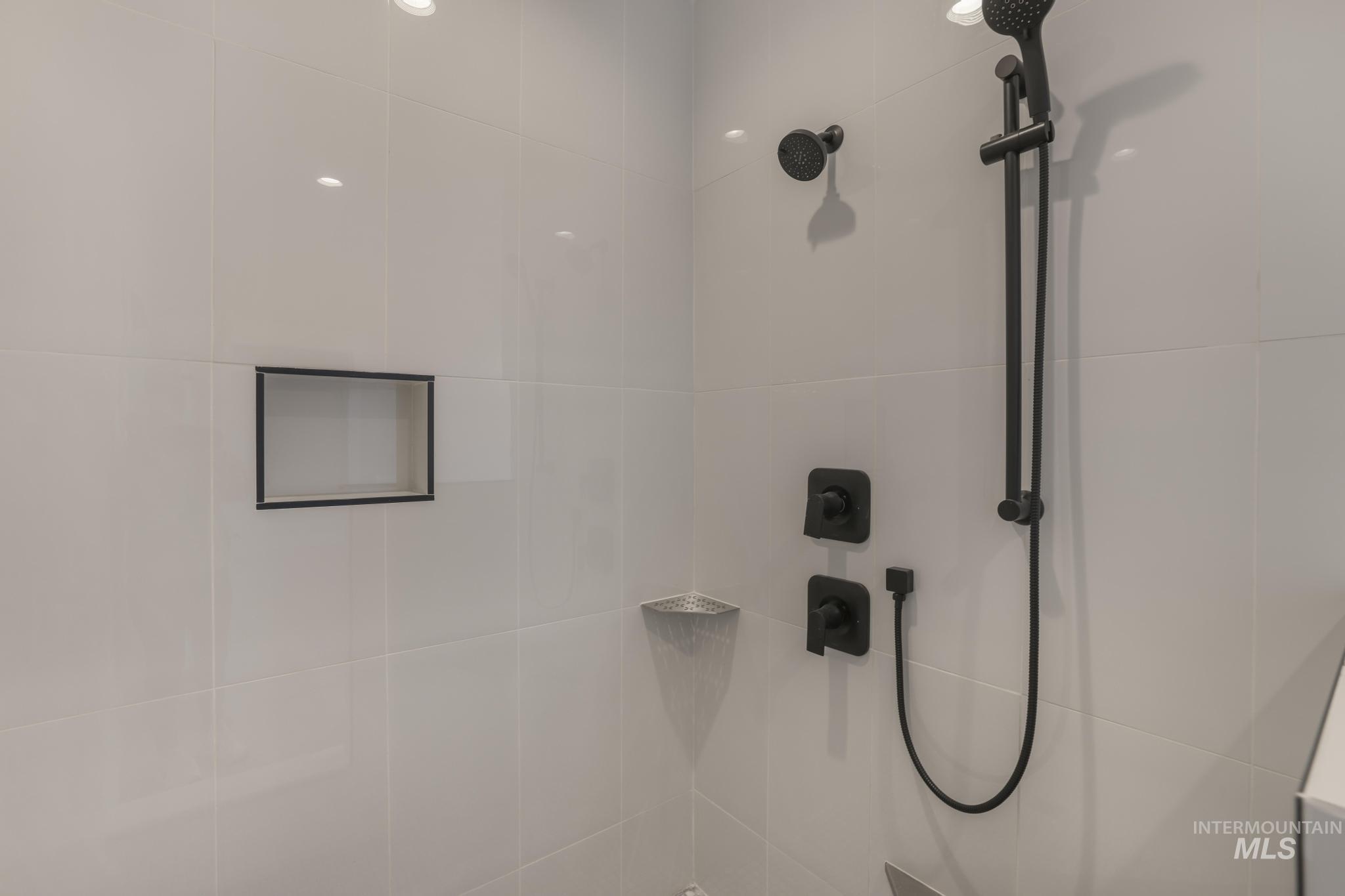 Bathroom view of a tile shower