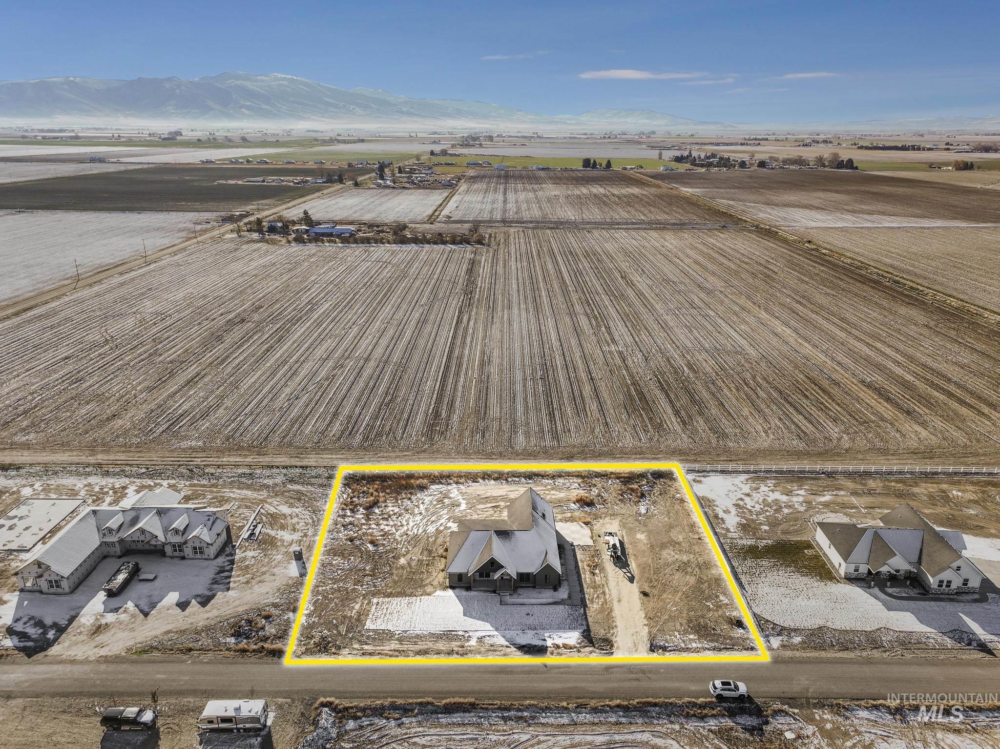 View of rural area featuring property boundaries highlighted and large plots for crops