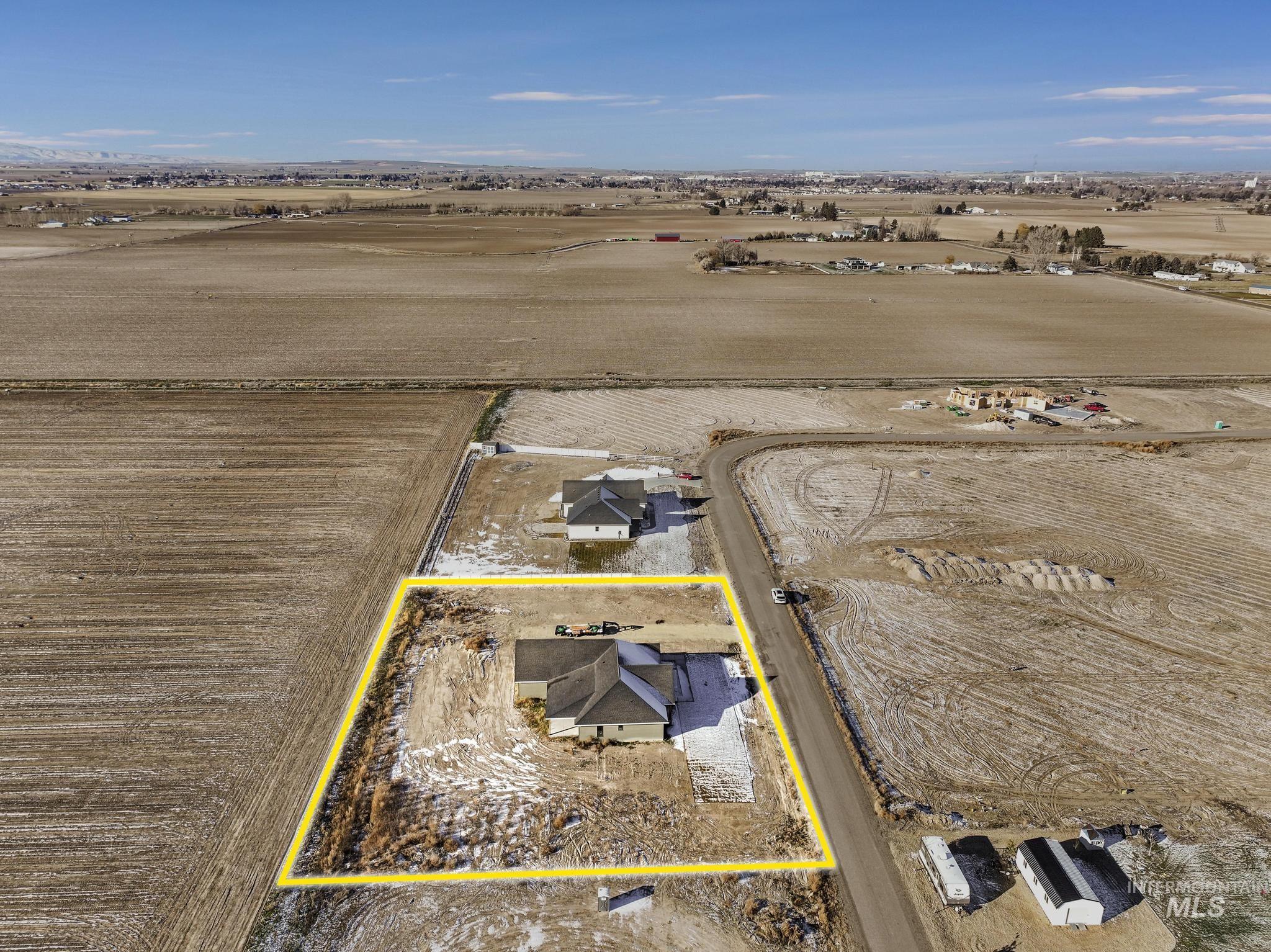 Aerial view of sparsely populated area with property boundaries highlighted